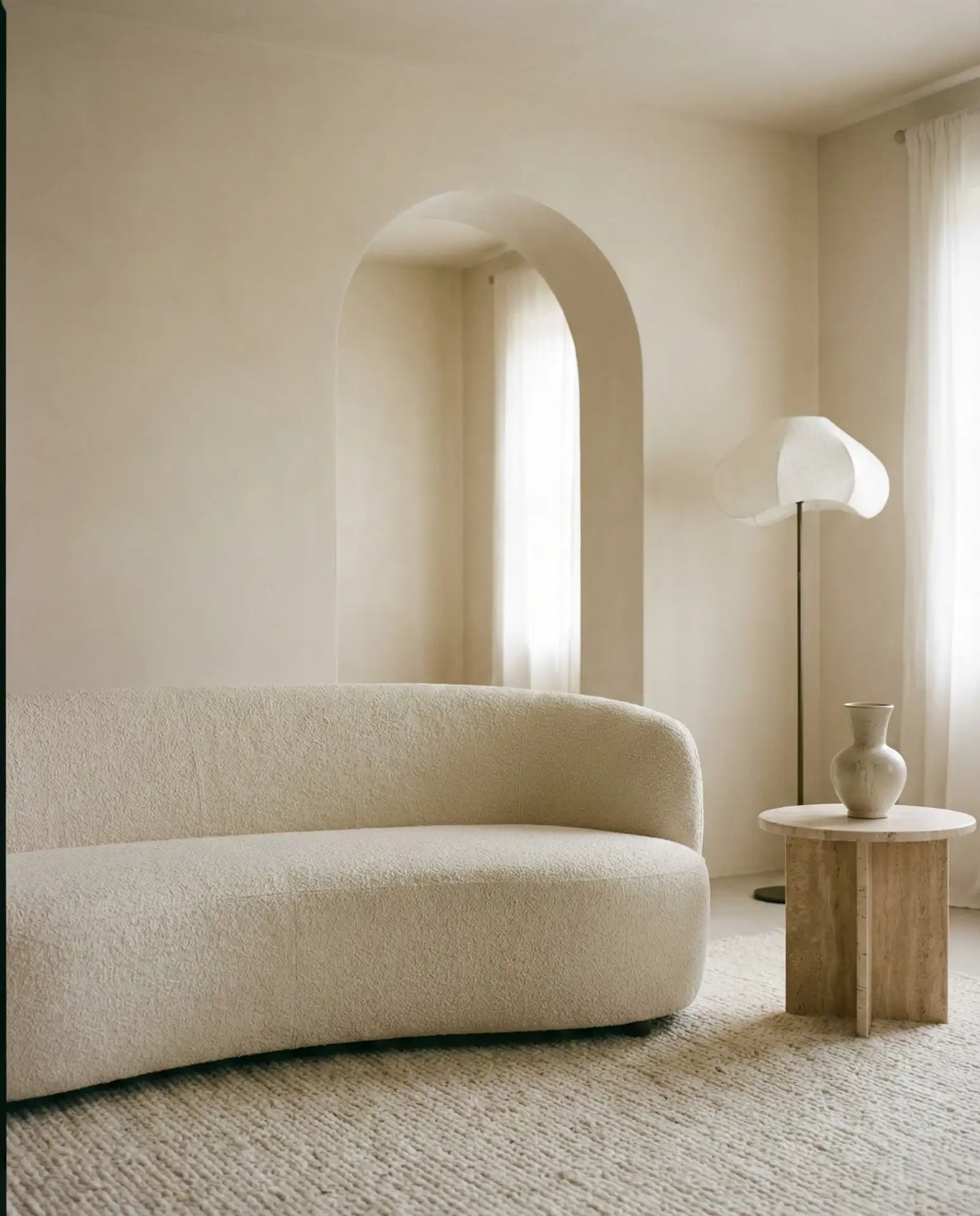 Minimal Arch Living Room with Sculptural Curves and Neutral Tones 1