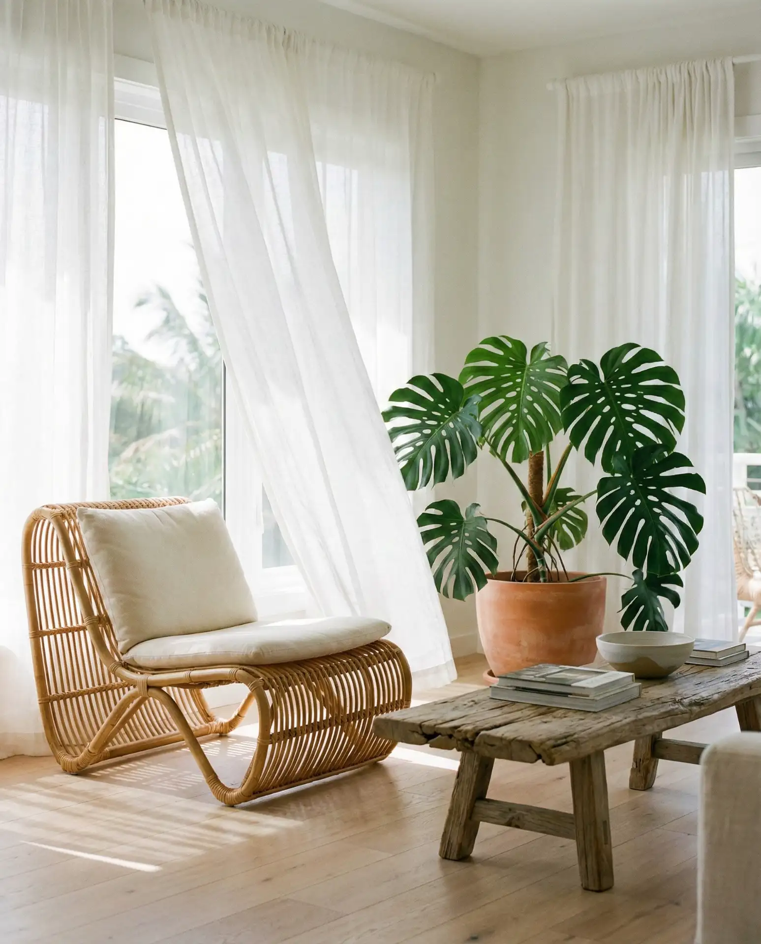 Tropical Living Room with Lush Greenery and Rattan Furniture 1