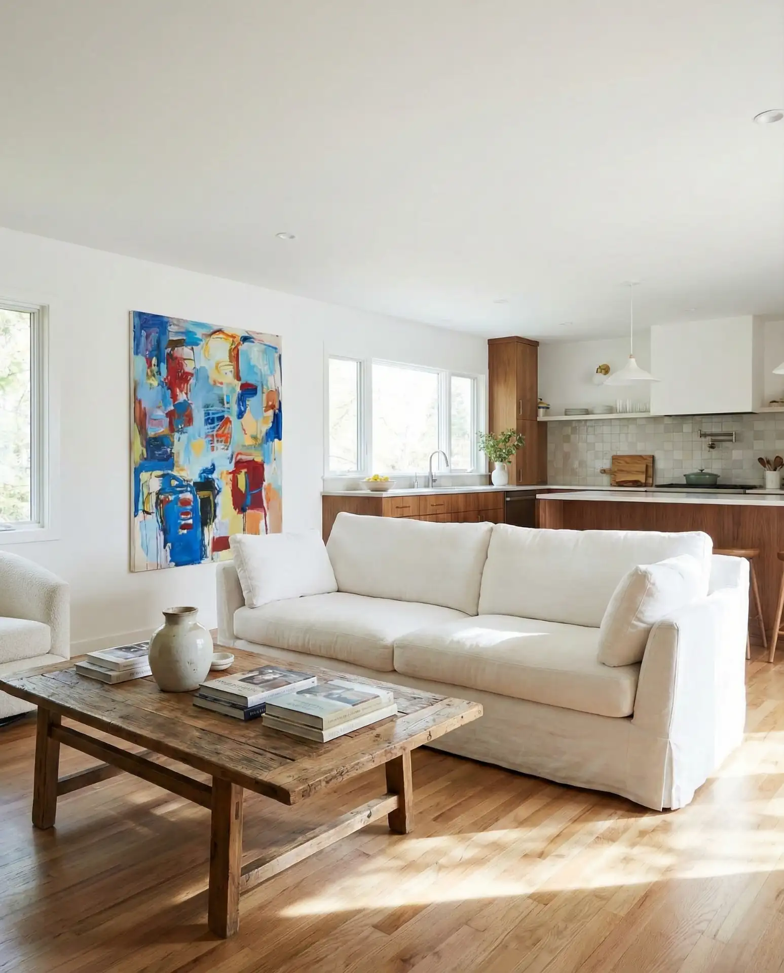 Bright White with Colorful Art in an Open Kitchen 1