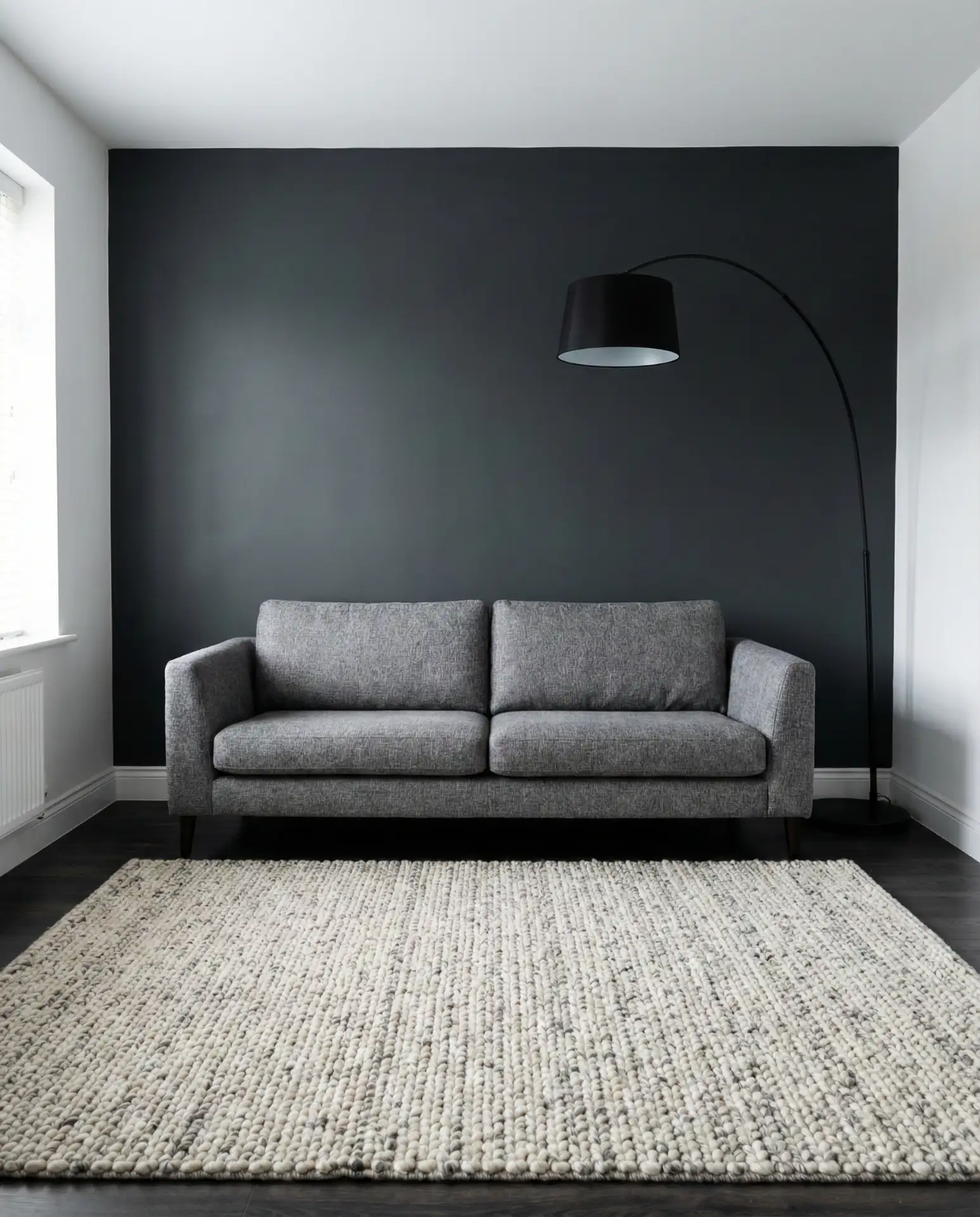 Charcoal Accent Wall Behind a Grey Couch 1