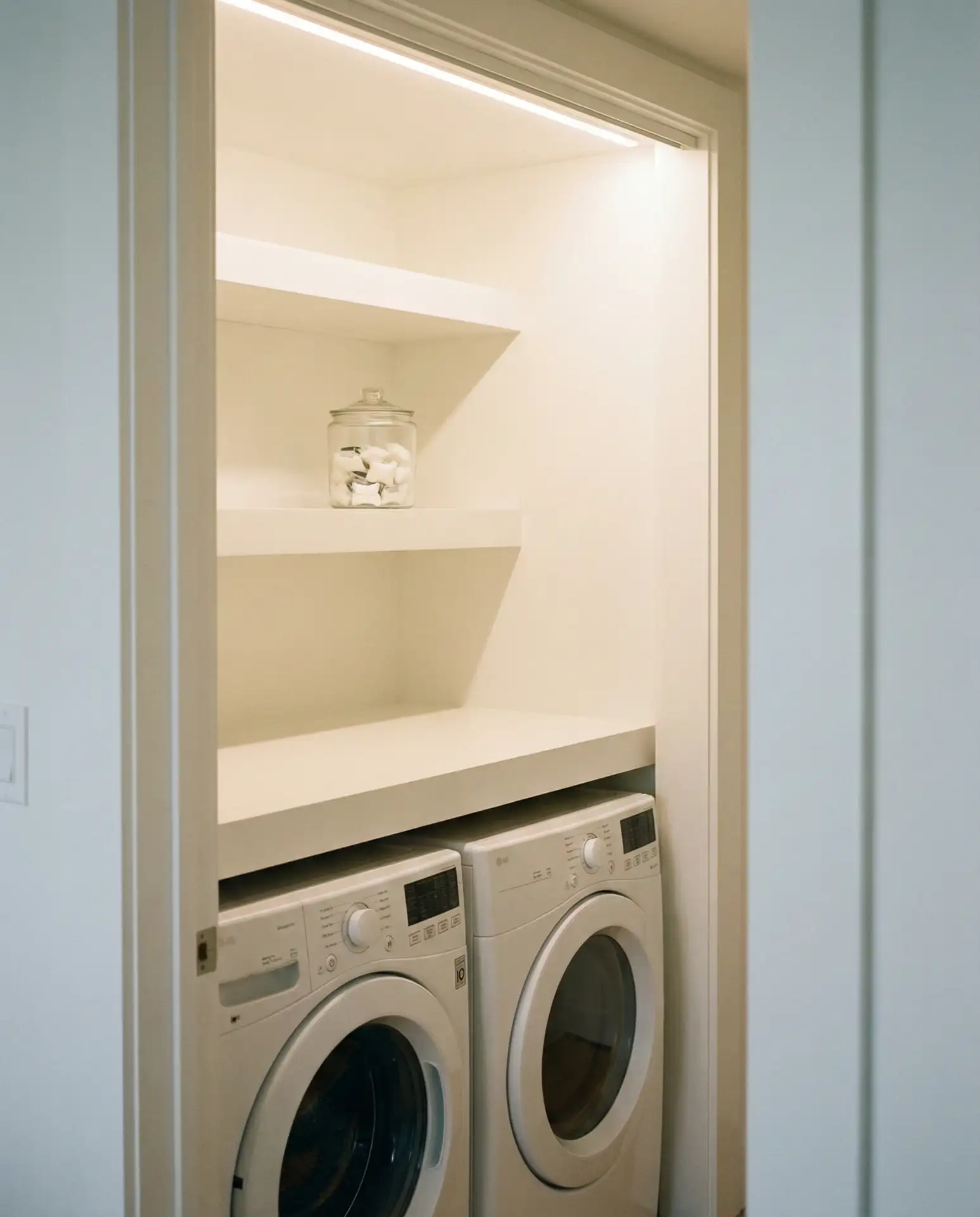 Minimalist All-White Closet Laundry 1