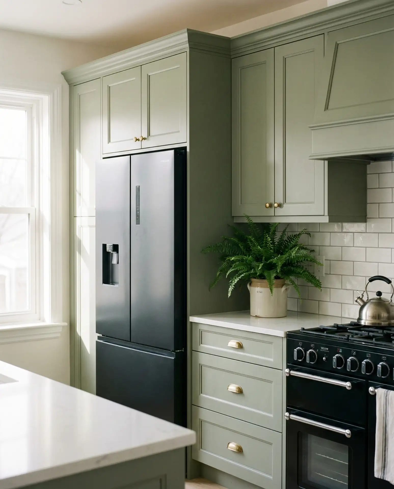 Sage Green Kitchen with Black Appliances 1