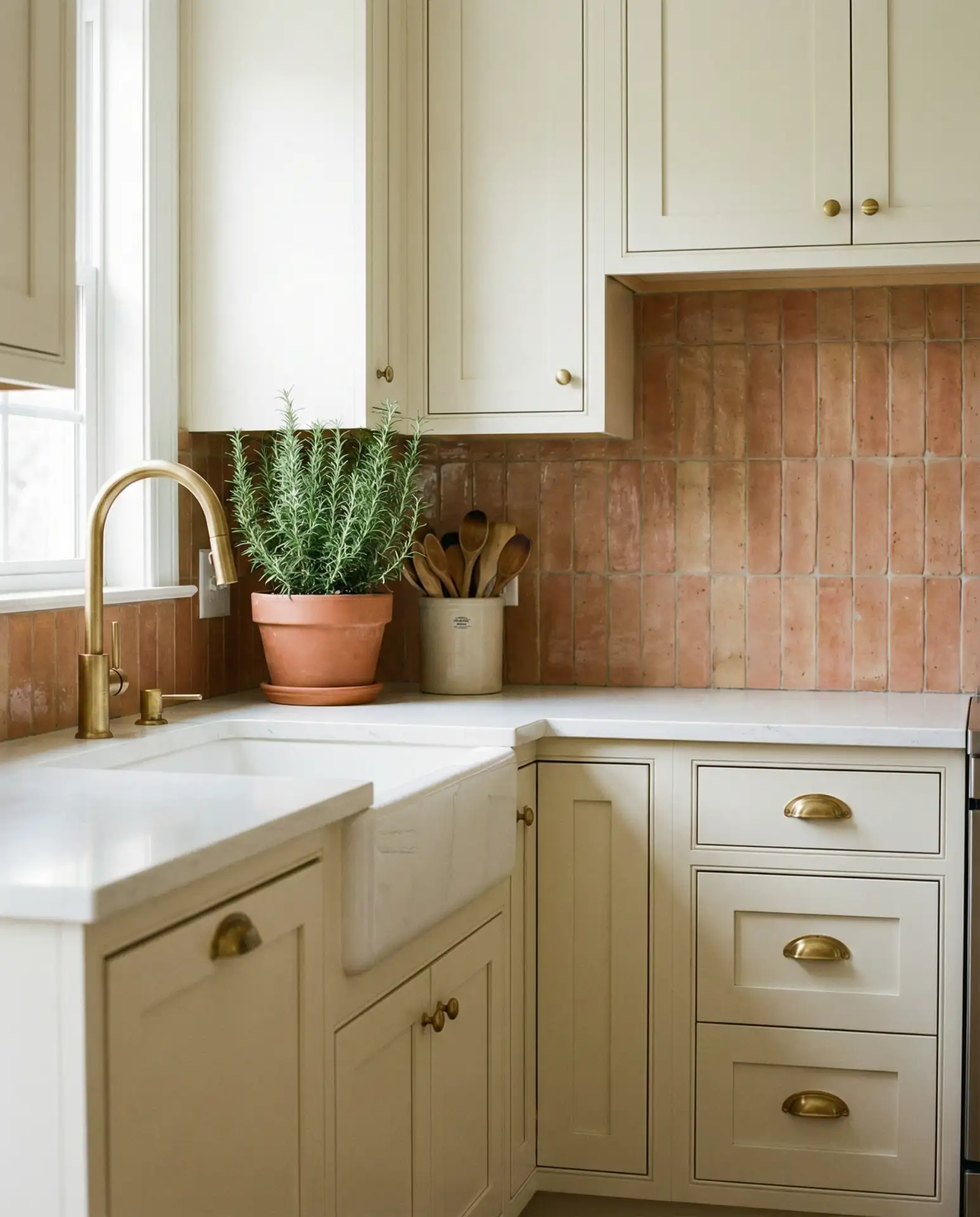 Warm Terra Cotta Tile Backsplash with Cream Cabinets 2