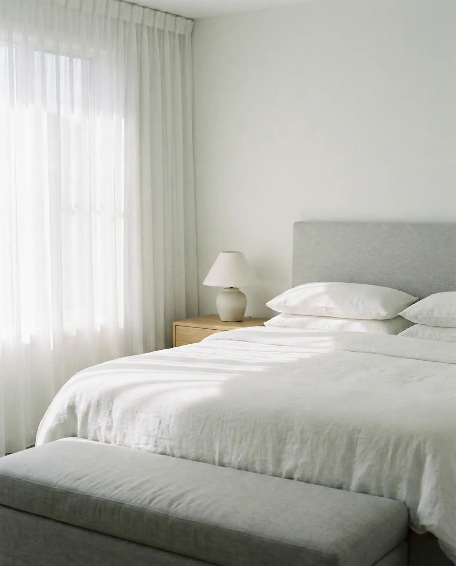 White Bedroom with Grey Upholstered Furniture 1