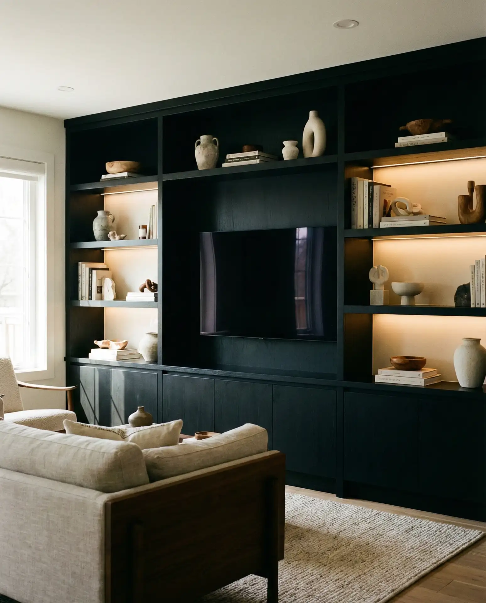 Black Accent Wall with Built-In Shelving and TV Niche 1