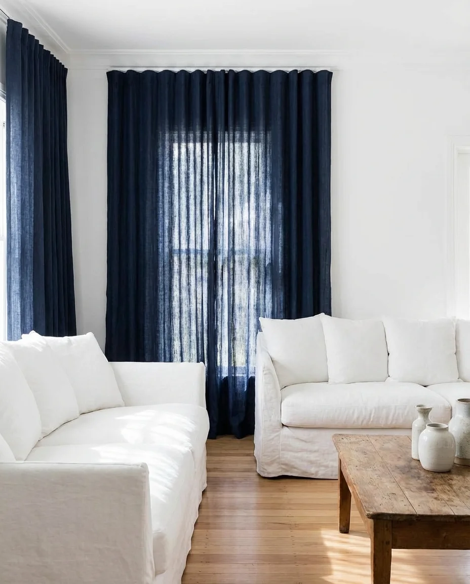Blue Curtains and Drapes in a White Living Room 1