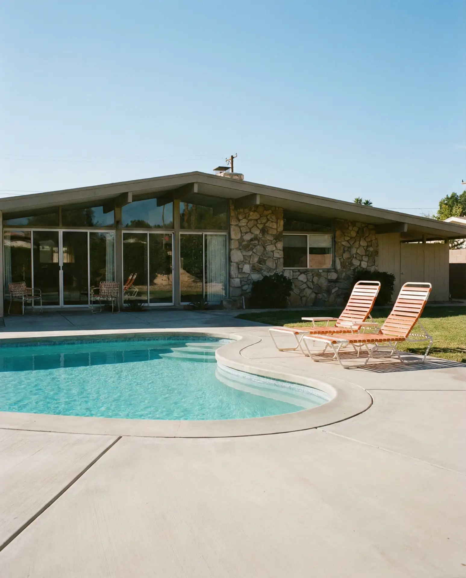 Mid-Century Modern Pool with Retro Lounge Chairs 2