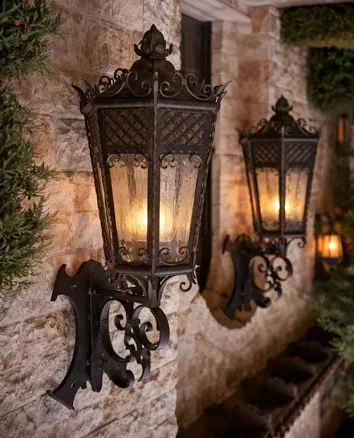 PAIR OF LARGE WROUGHT IRON WALL LANTERNS 38