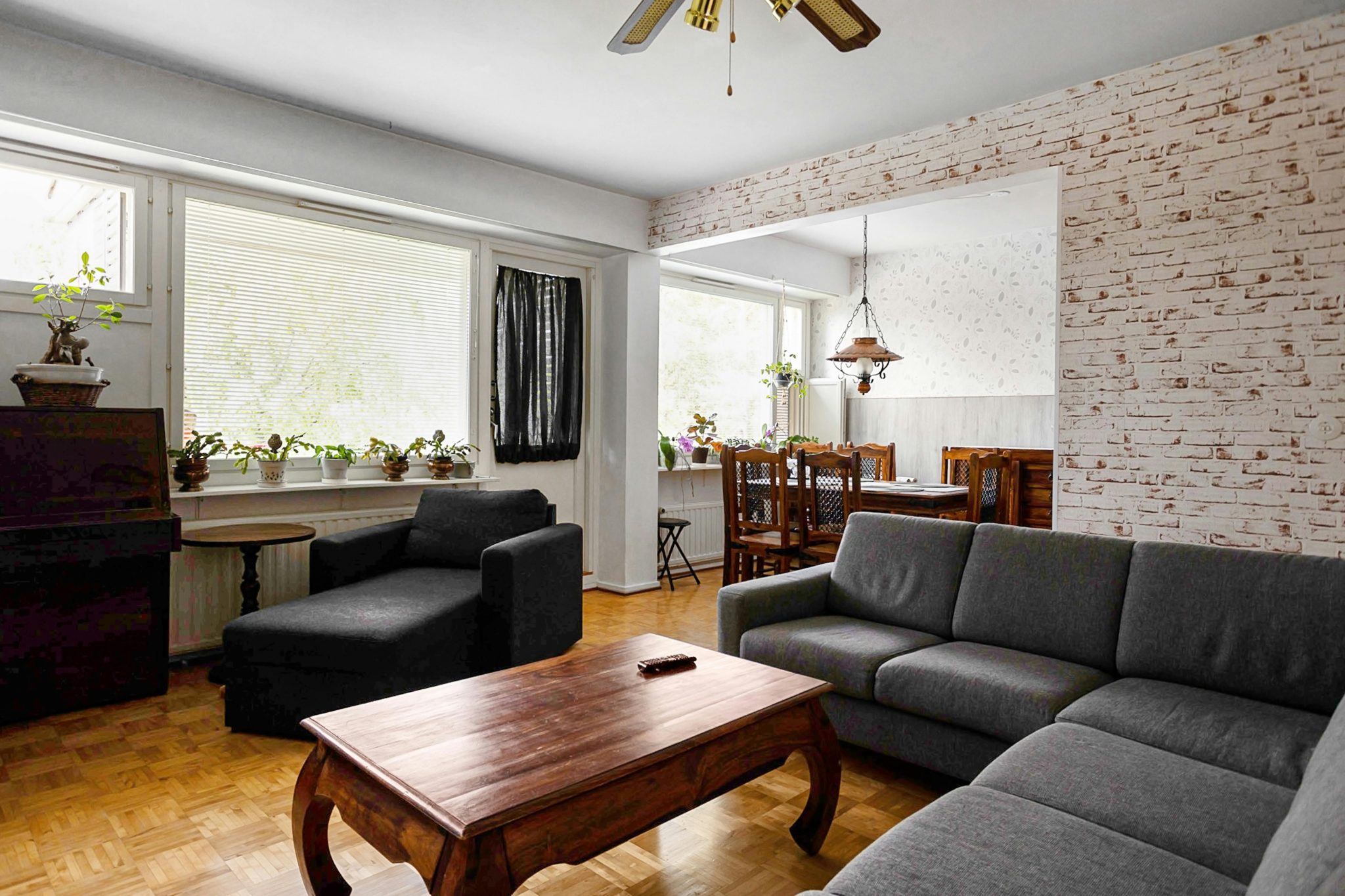 A bright, contemporary living room featuring stylish furniture and natural light.