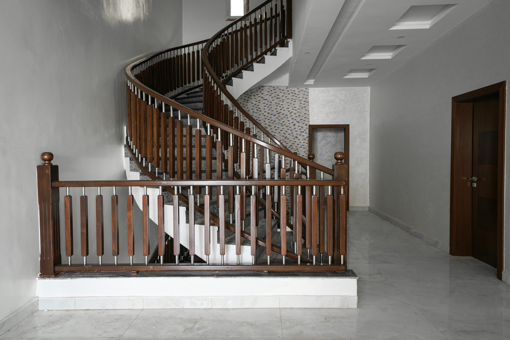 A stunning spiral staircase in a modern home interior in Nouakchott, showcasing minimalist design.