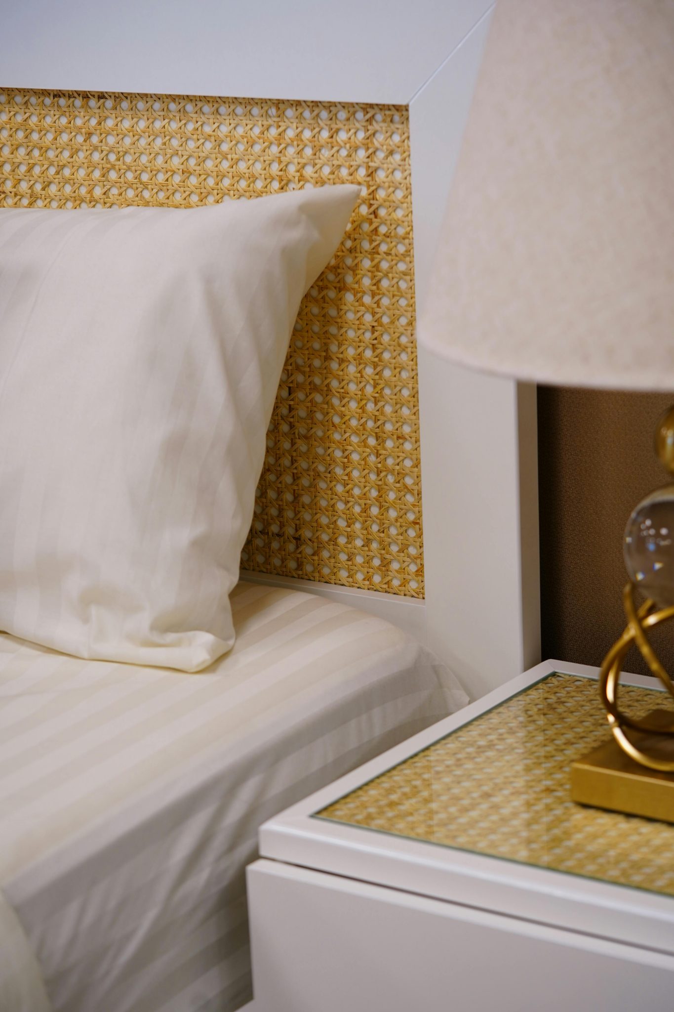 A stylish bedroom corner featuring modern furniture and a warm color palette.