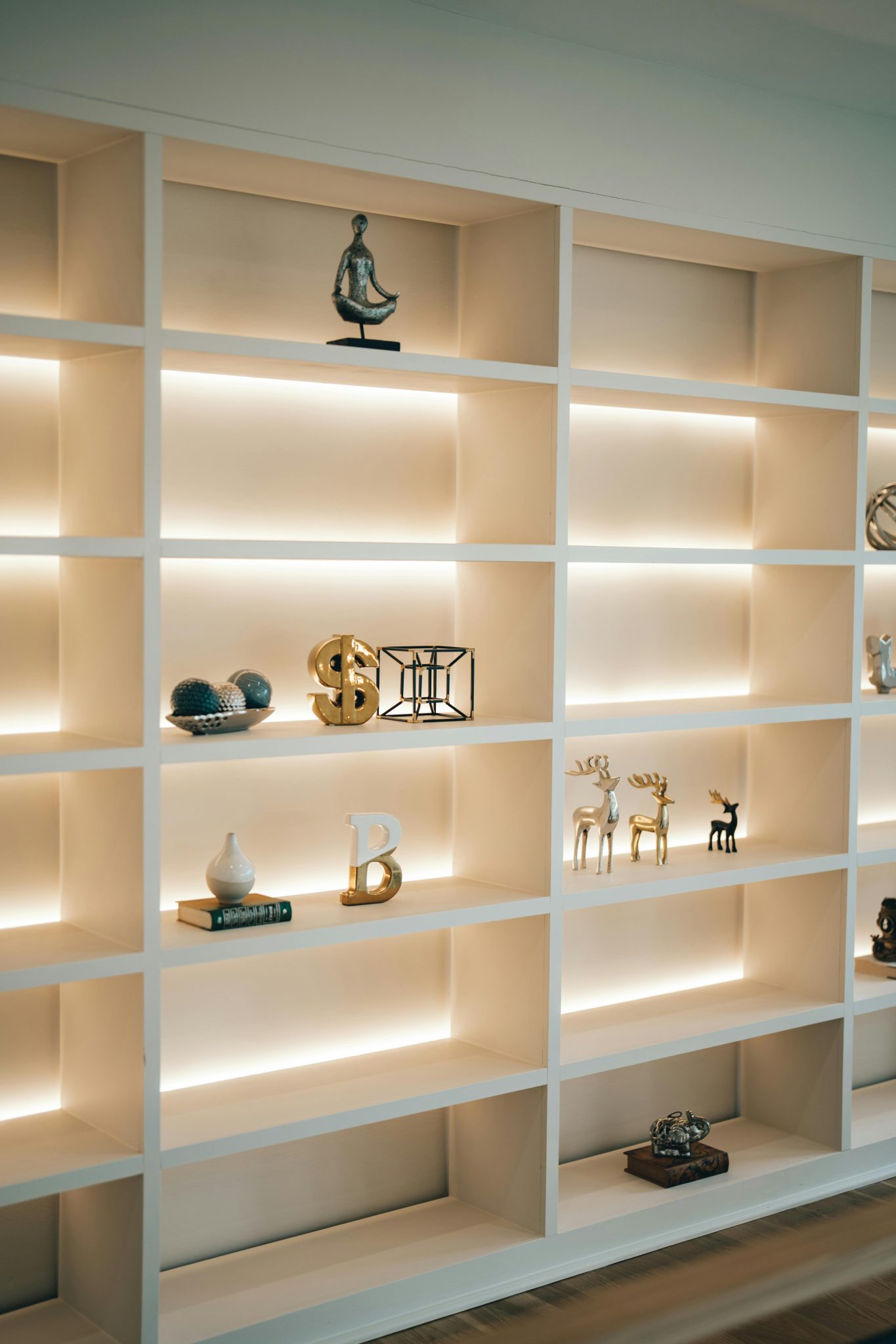 A stylish illuminated bookshelf featuring modern decor and minimalistic design, perfect for home interiors.