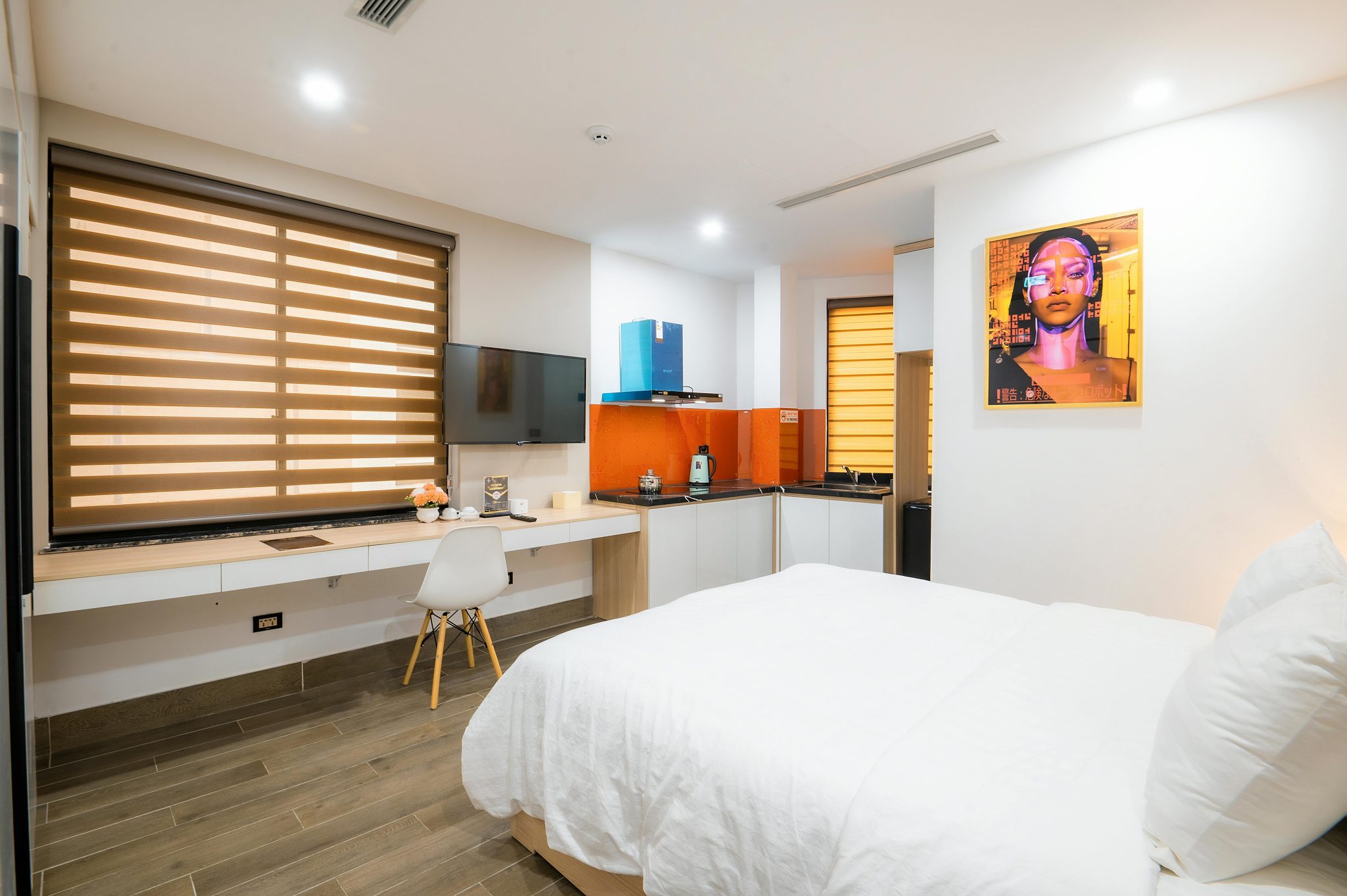 Bright modern hotel room with stylish decor and cozy ambiance.