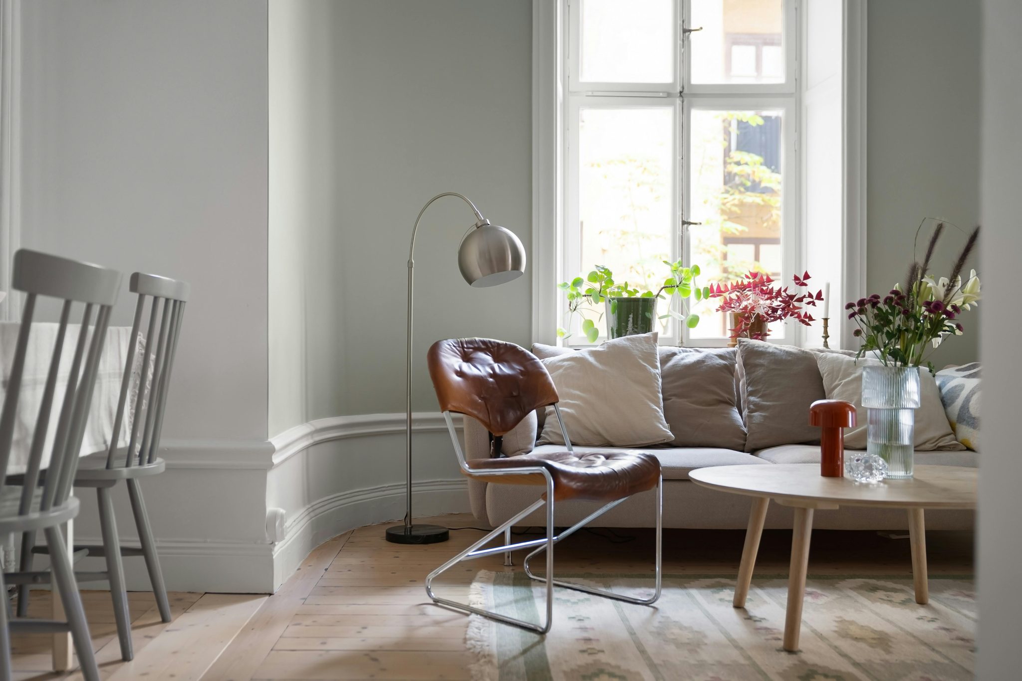 Bright Scandinavian living room with modern furniture and natural light.