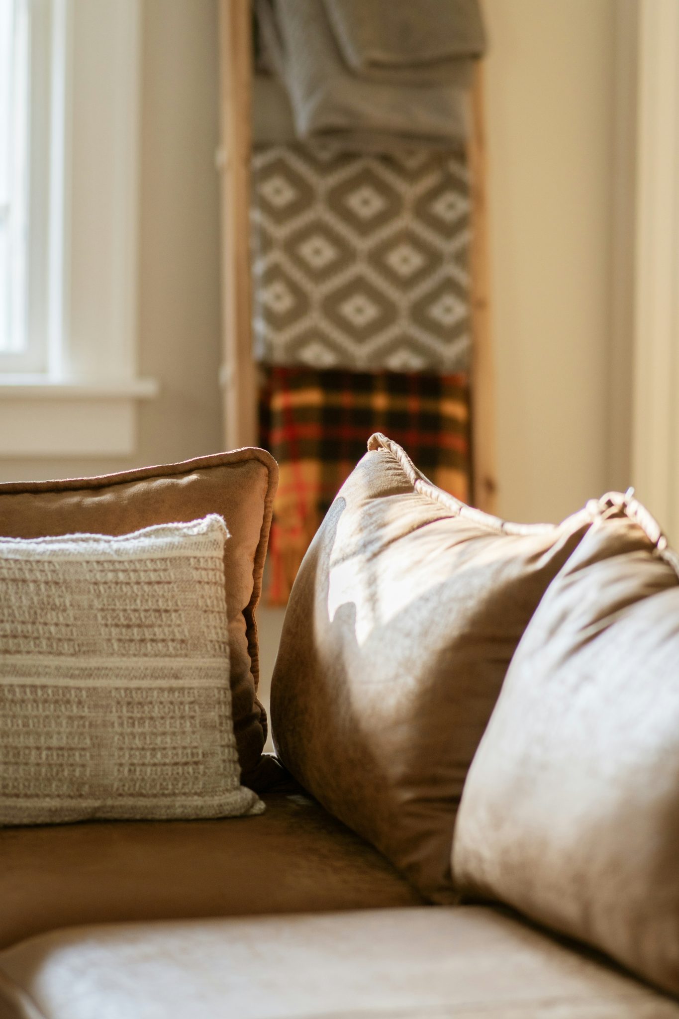 Cozy living room with plush sofa and blankets