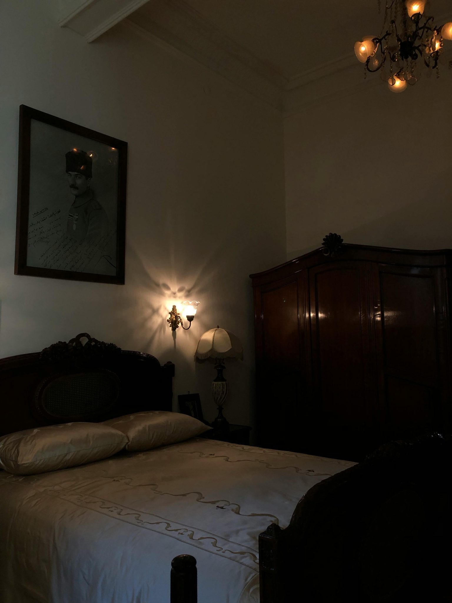 Cozy vintage bedroom with wooden furniture and soft warm lighting.