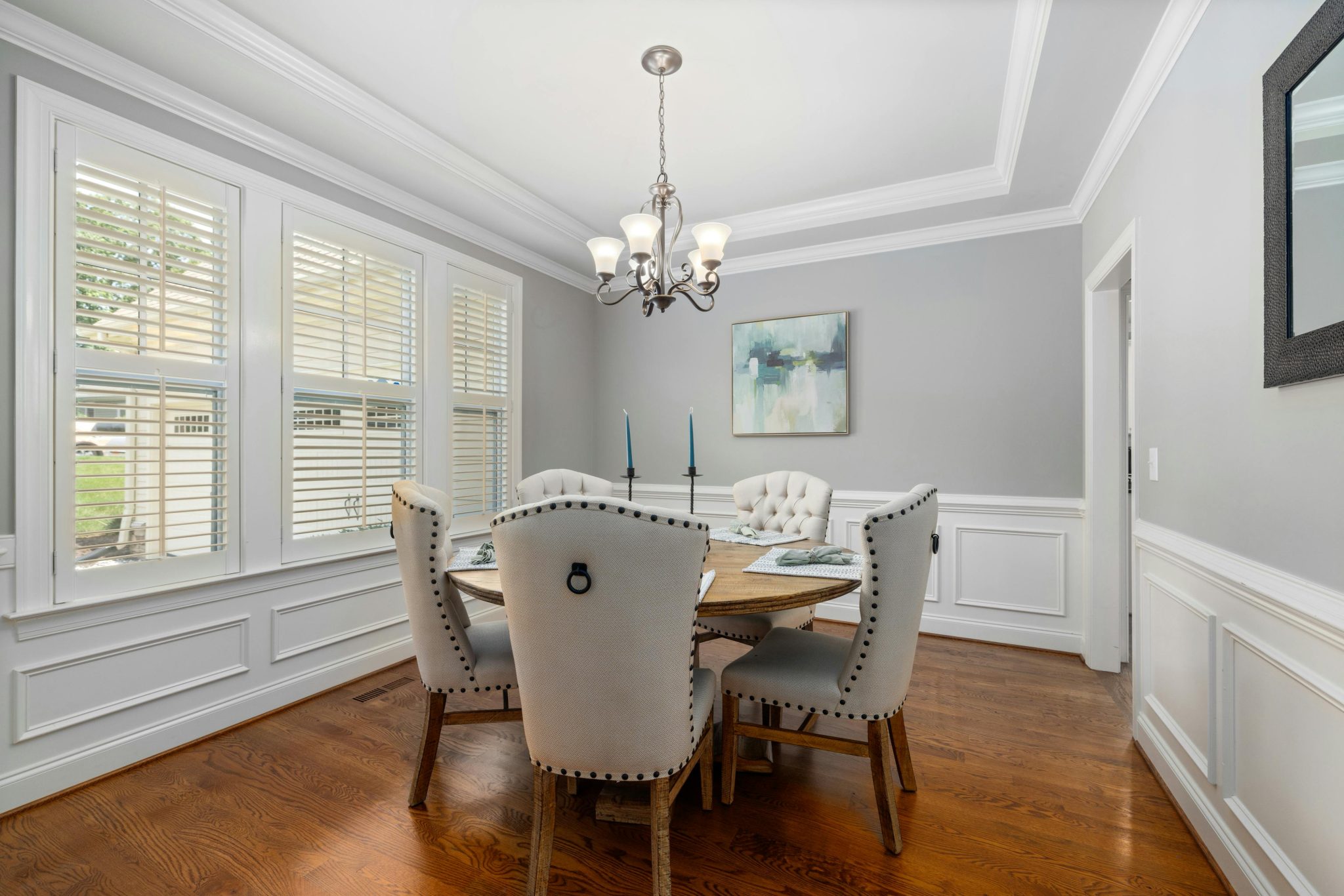 Elegant dining room featuring classic furniture, soft lighting, and modern interior design elements.