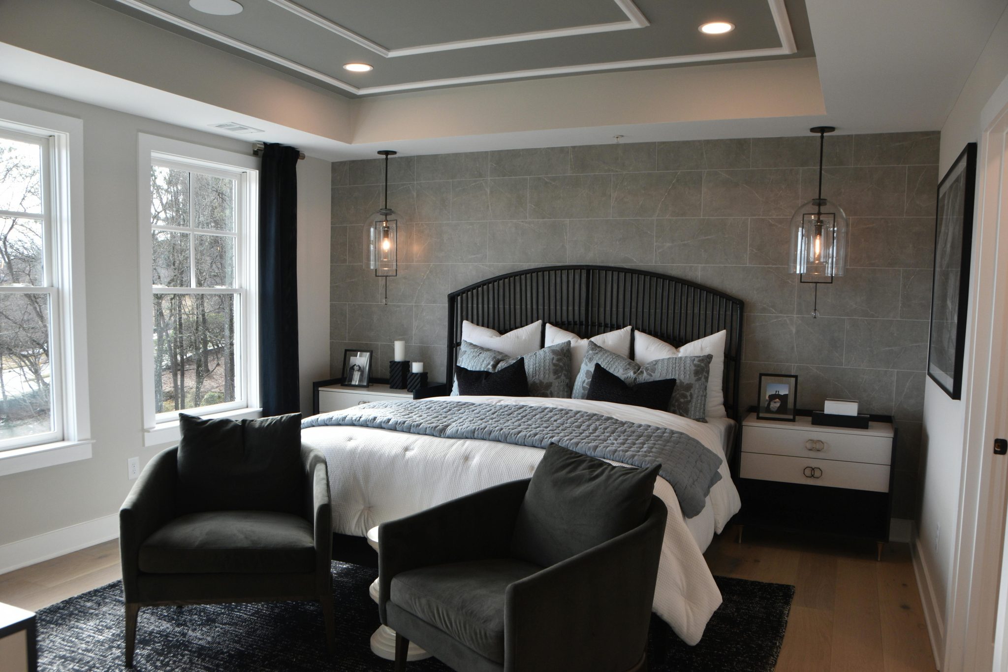Elegant modern bedroom featuring stylish decor, cozy furniture, and soft lighting creating a warm ambiance.