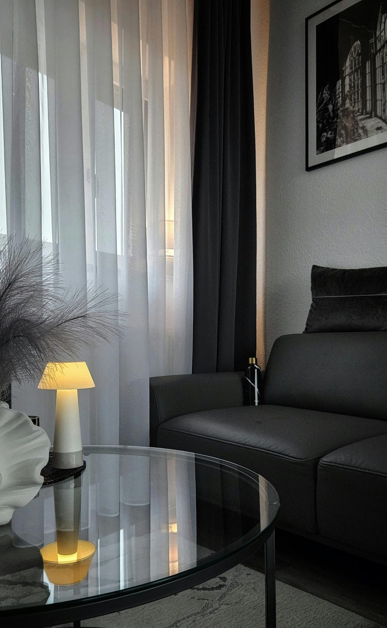 Elegant modern living room in monochrome tones with stylish decor.