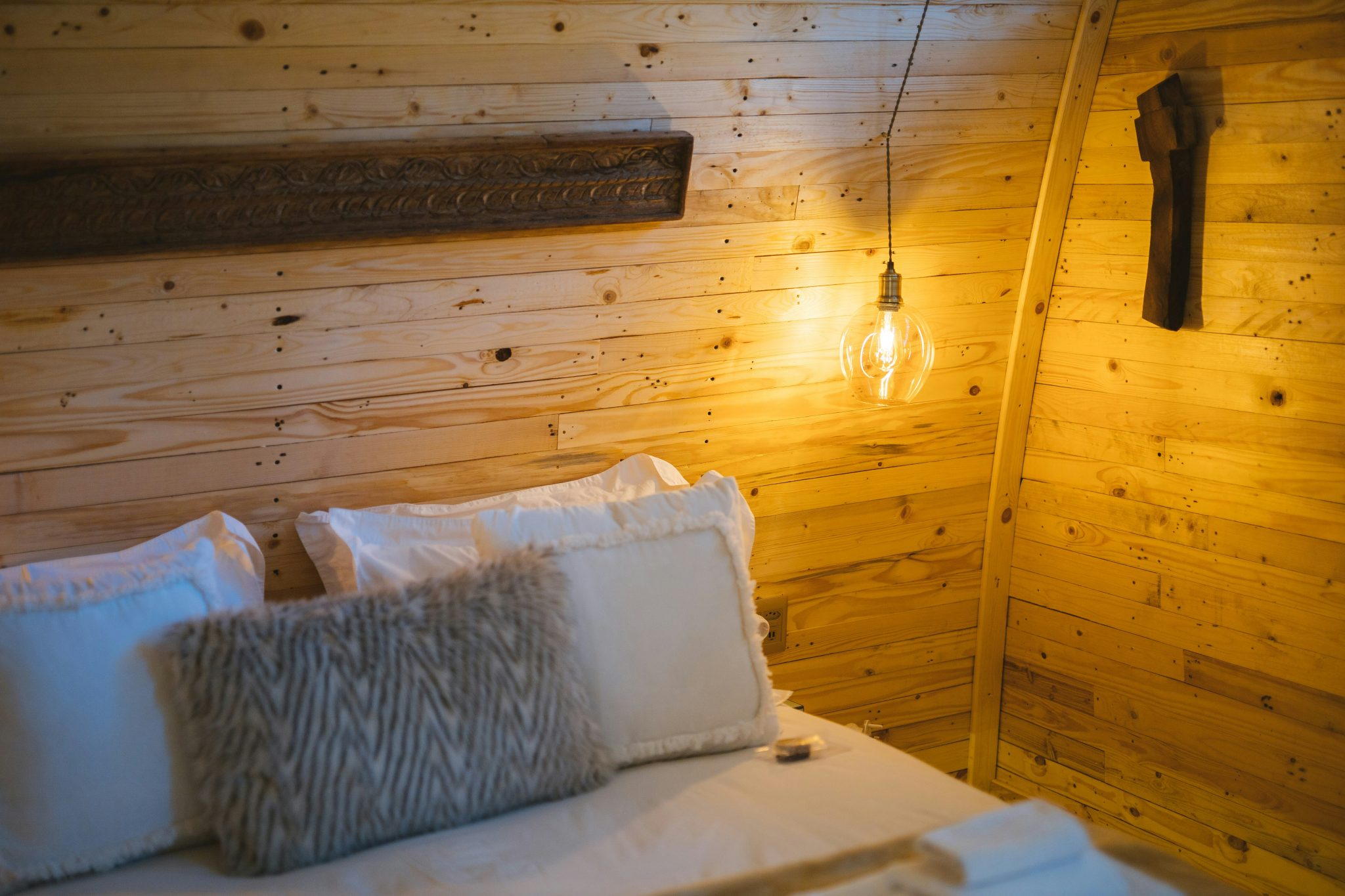 Hotel Bedroom with a wooden warm interior.