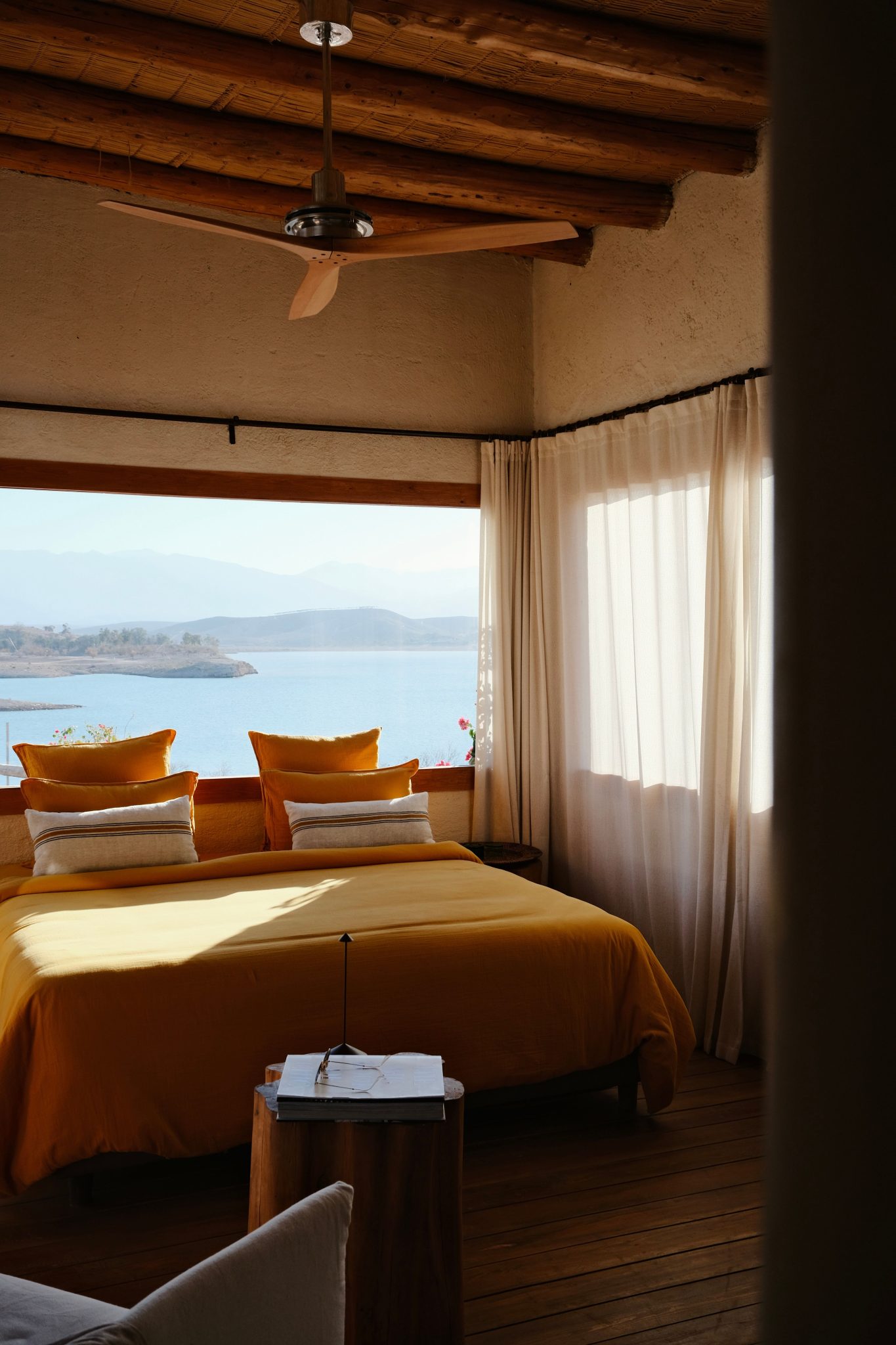 Inviting bedroom with lake view in Aguergour, Morocco, perfect for relaxation.