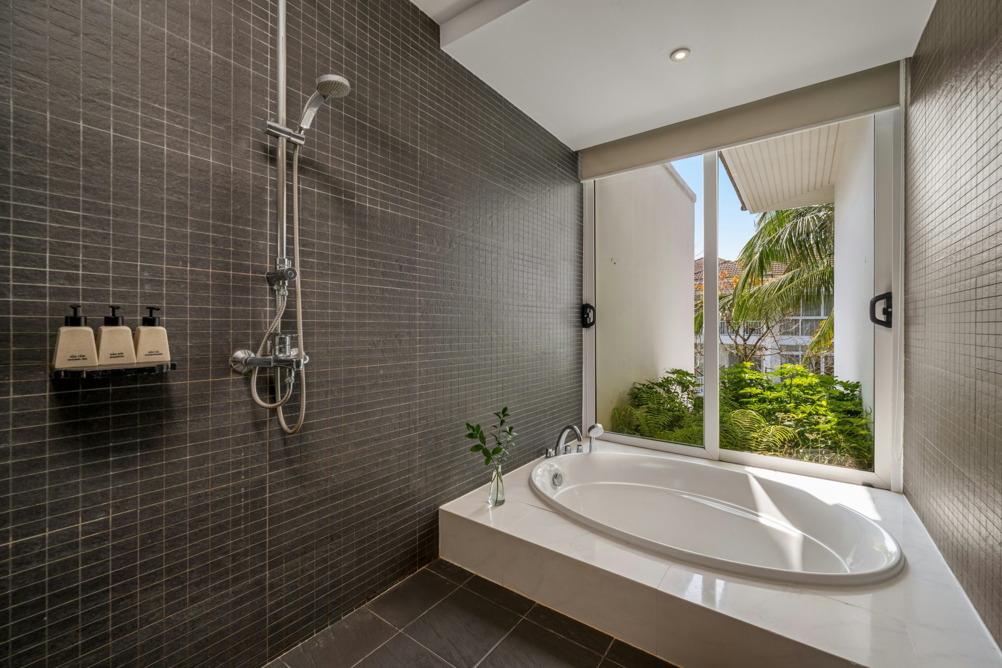 Modern bathroom with bathtub and shower area.