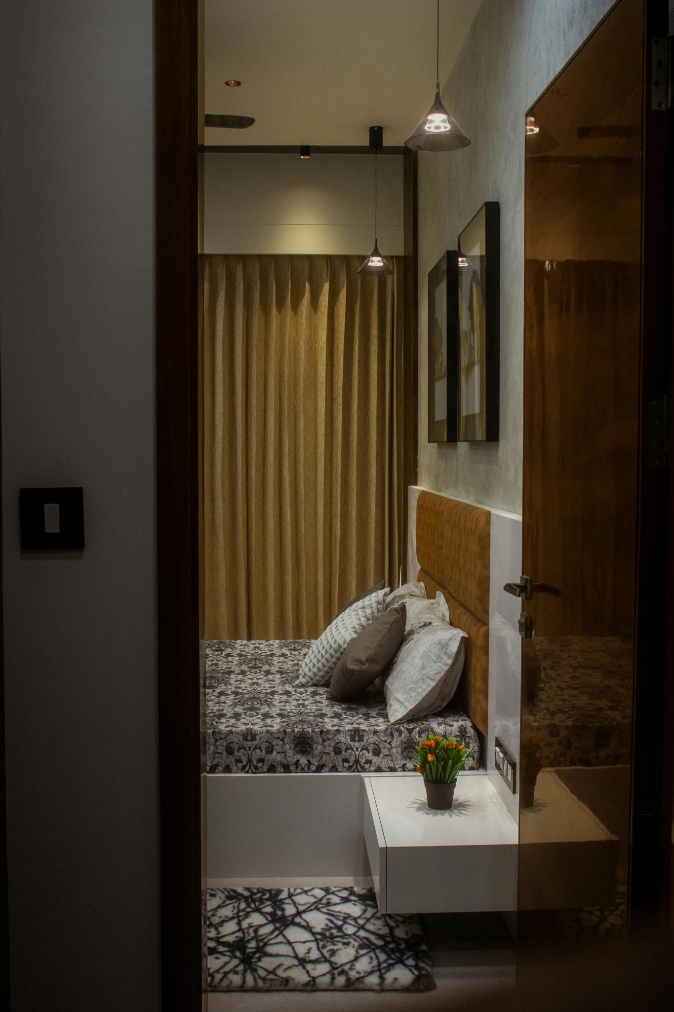 Modern bedroom with stylish decor and soft lighting, perfect for relaxation.