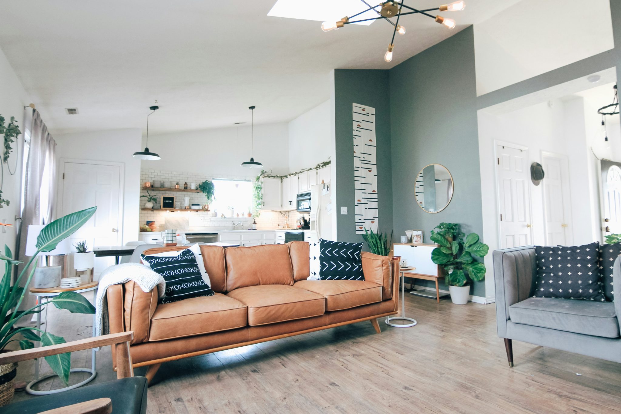Our living room has been the main area we have focuses our attention on making comfortable for us. My husband got me this couch for my birthday because I have been head over heels with it. (it is the