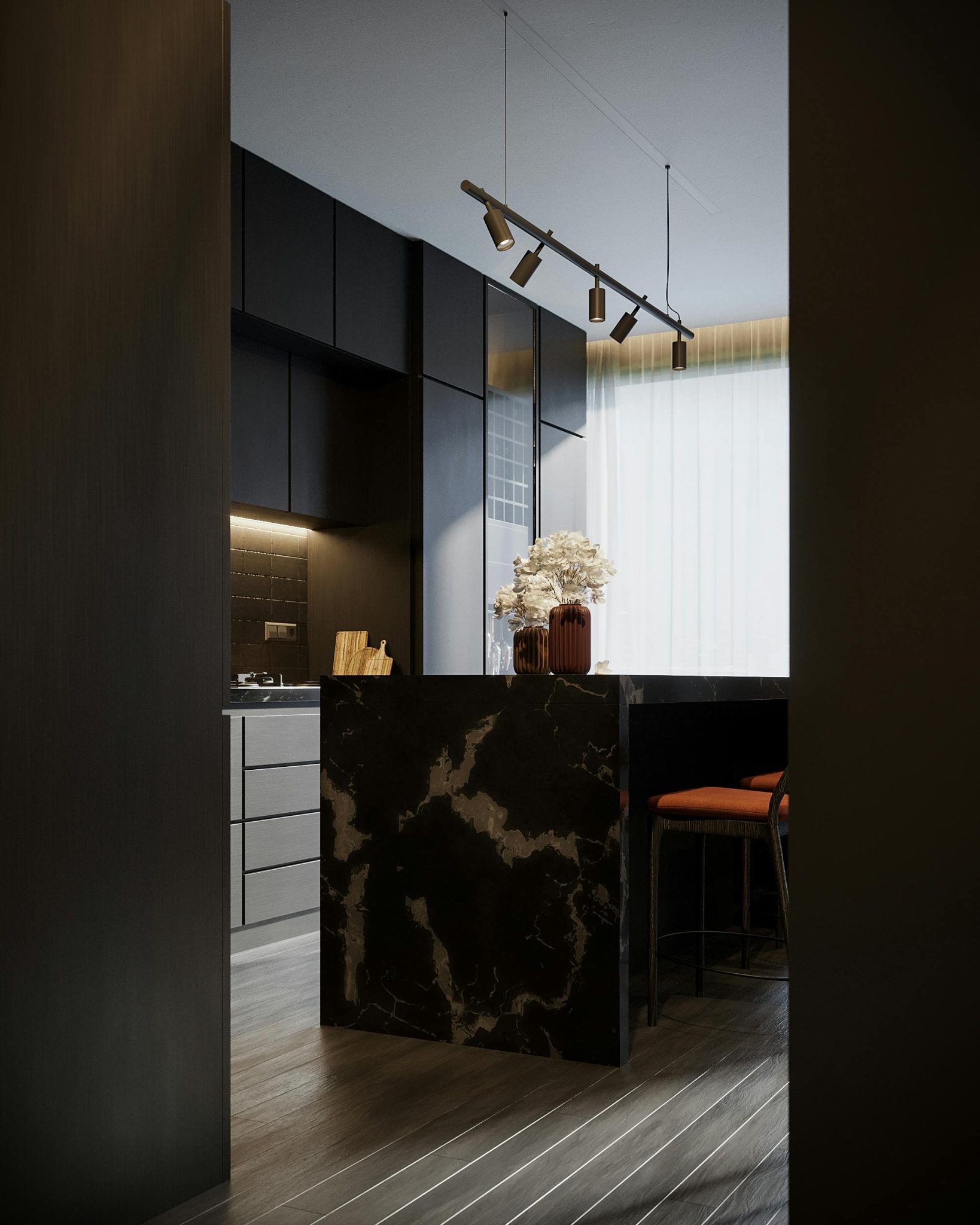 Sleek modern kitchen interior featuring a marble island, dark cabinets, and elegant lighting.