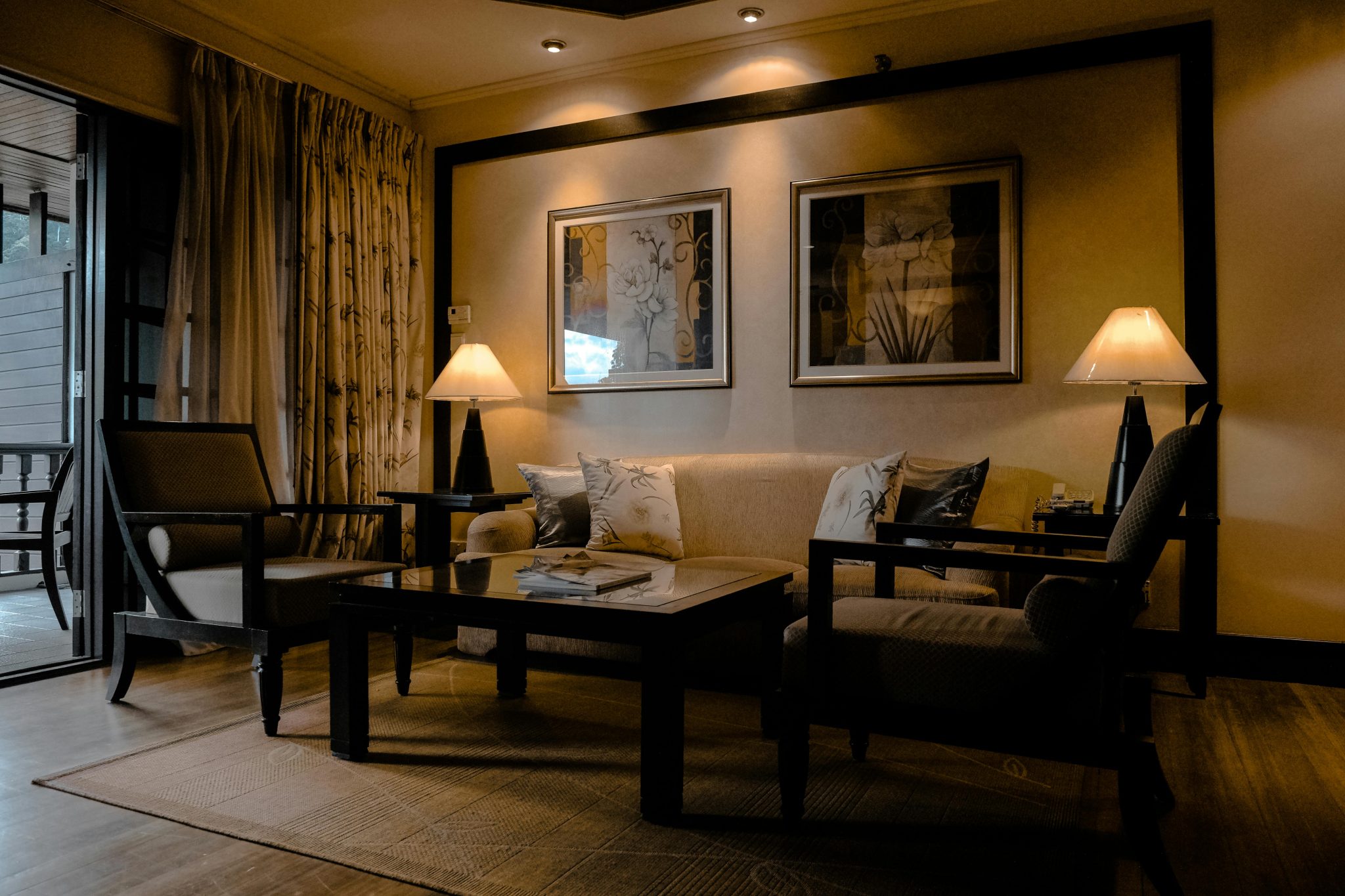 Stylish and cozy living room featuring elegant furniture and warm lighting.