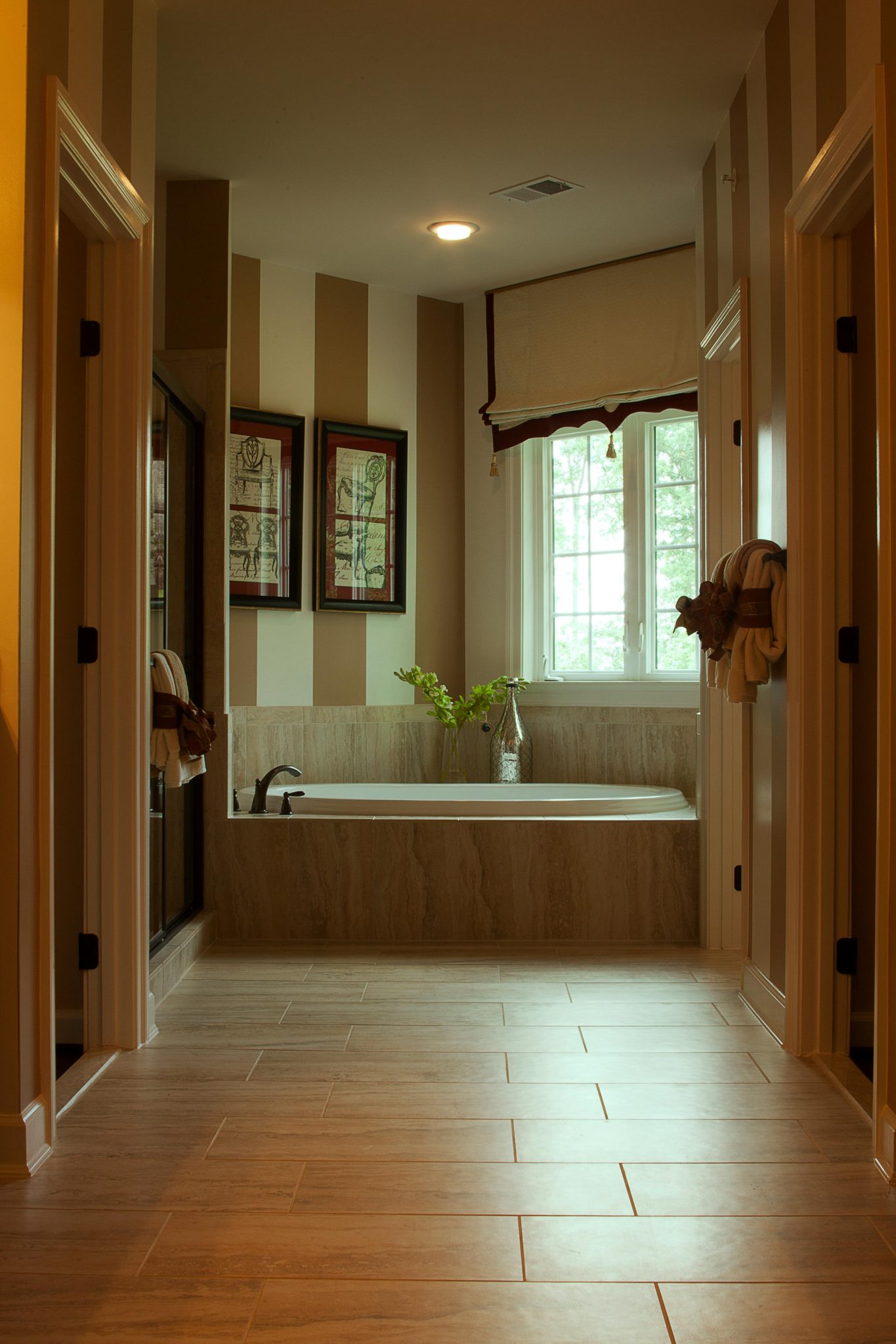 Stylish bathroom featuring a modern bathtub and chic interior design.