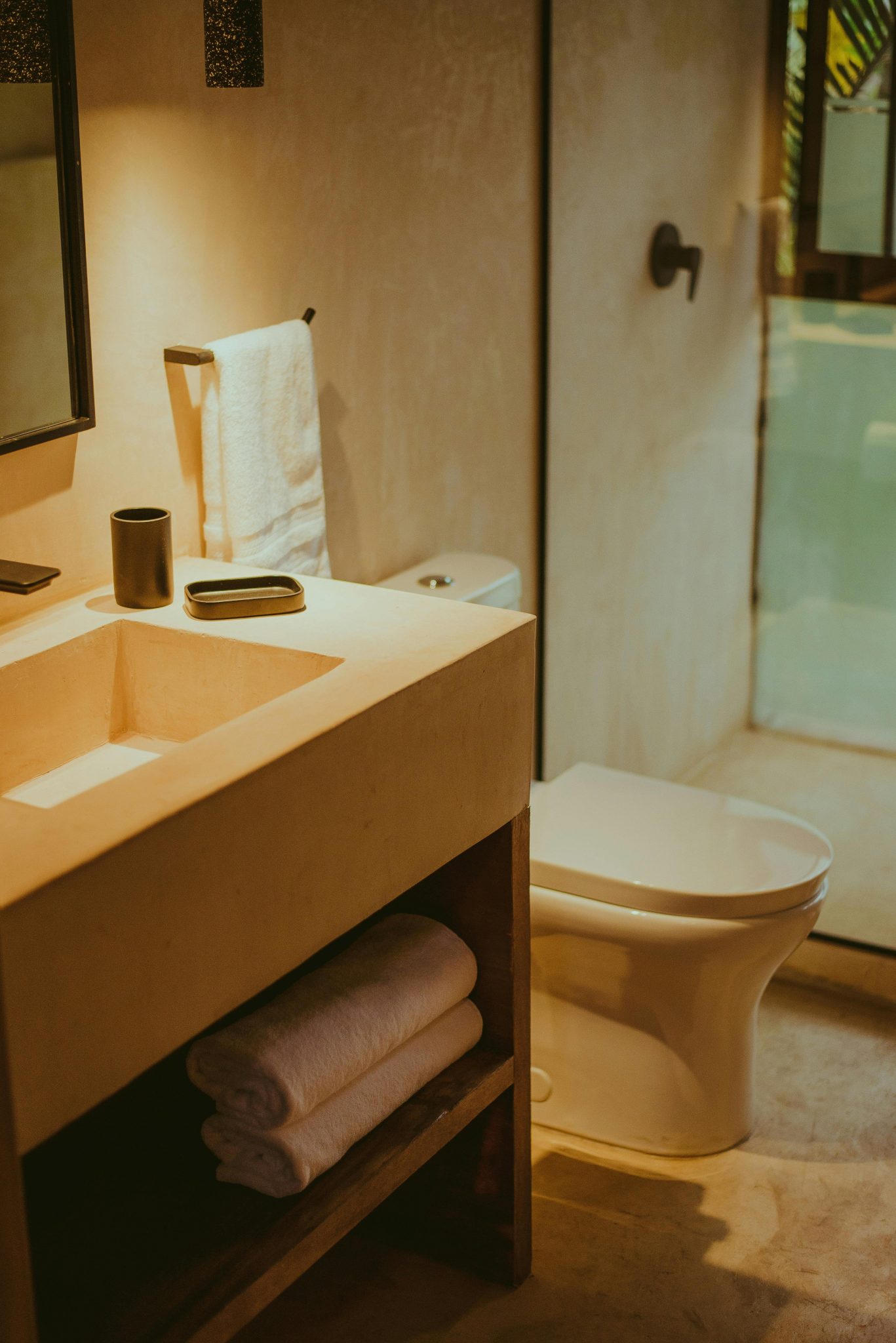 Stylish bathroom featuring rustic design with elegant fixtures and ambient lighting.