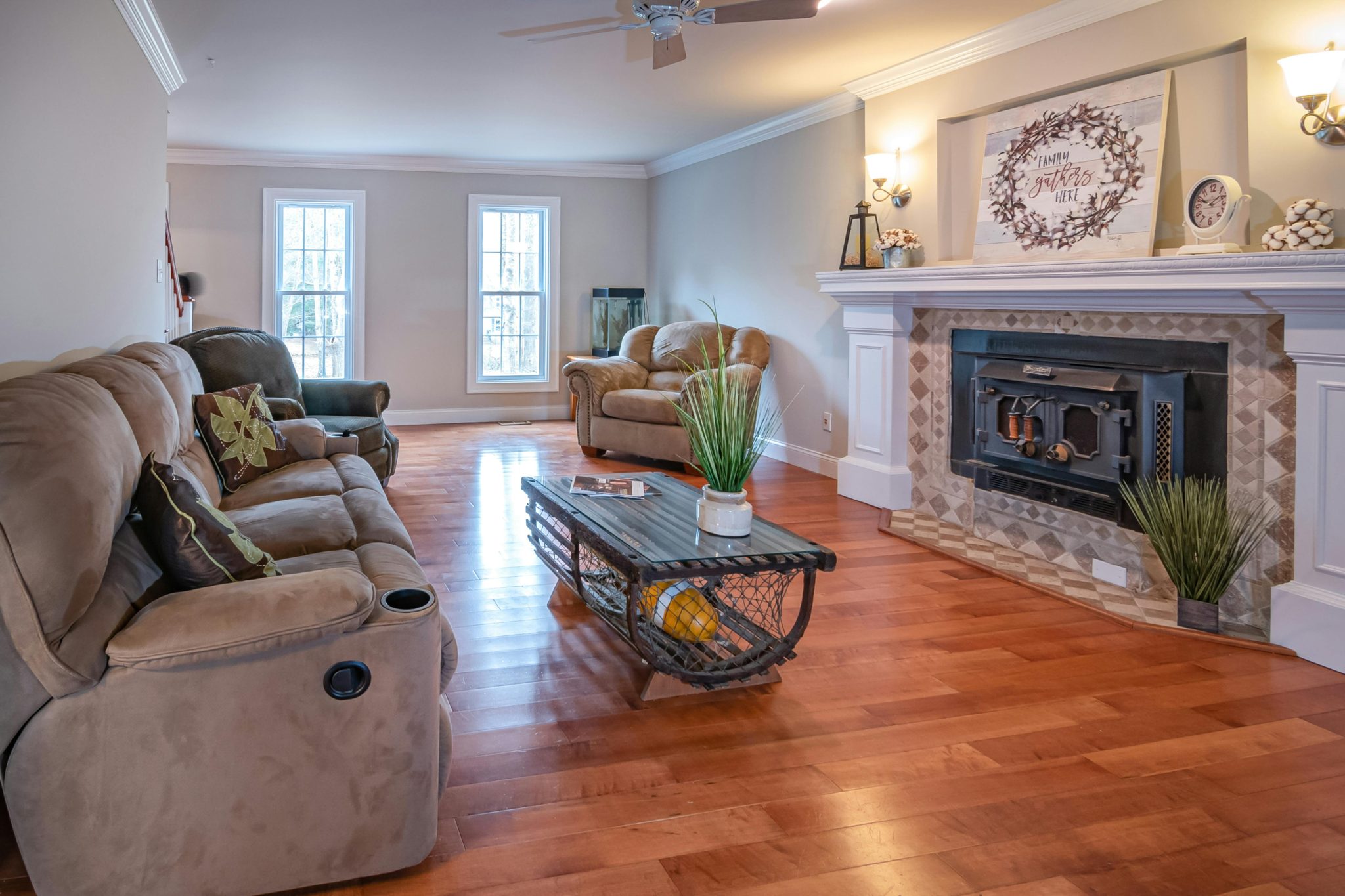 Warm and inviting living room featuring a modern fireplace and plush sofas.