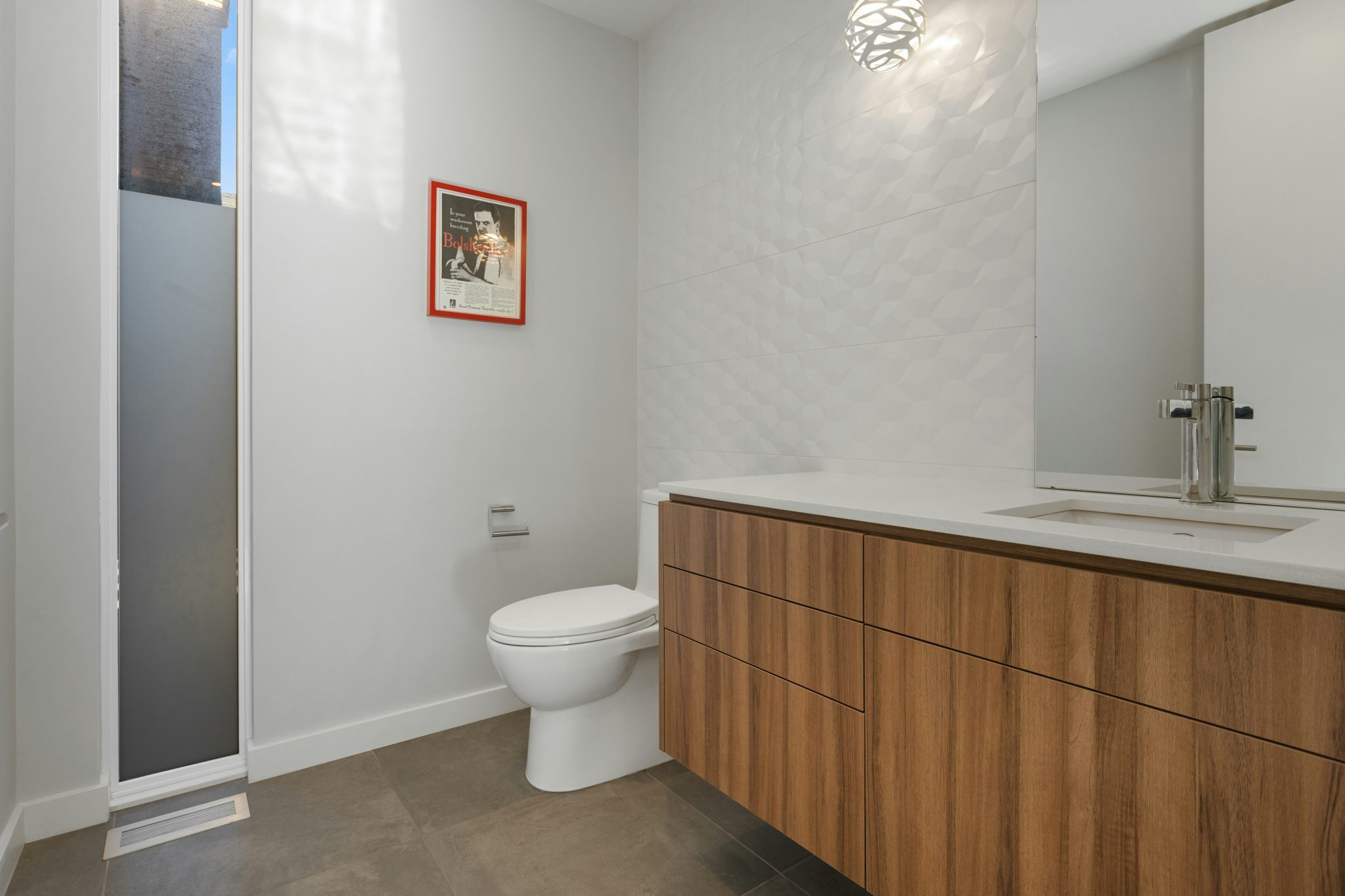 a bathroom with a toilet and sink