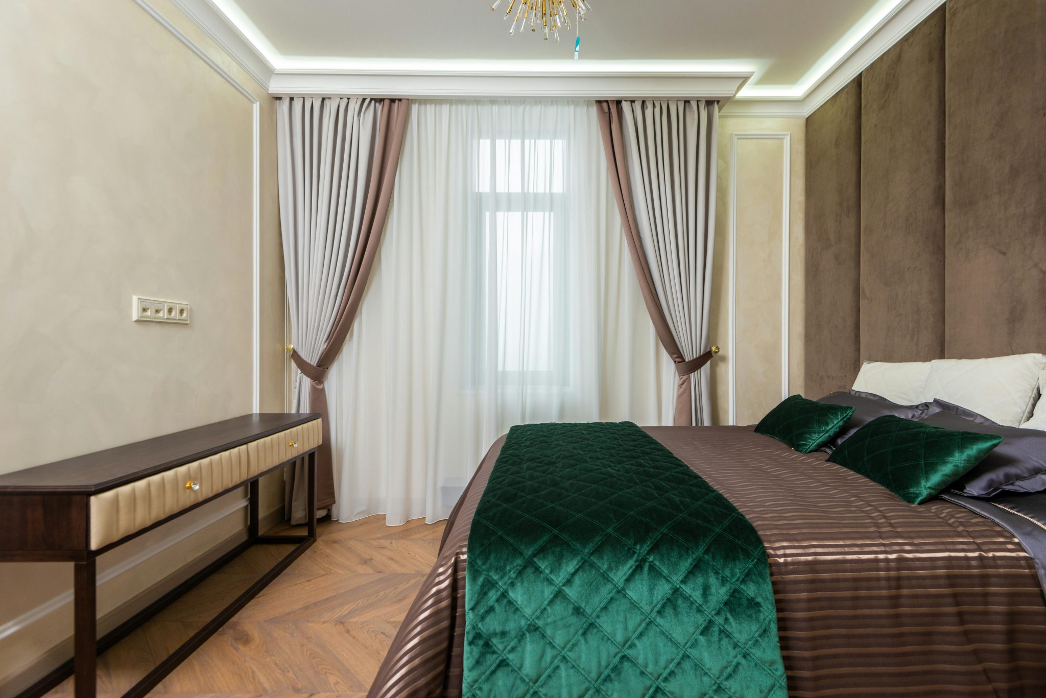 A chic bedroom interior with elegant drapes and stylish modern furniture.
