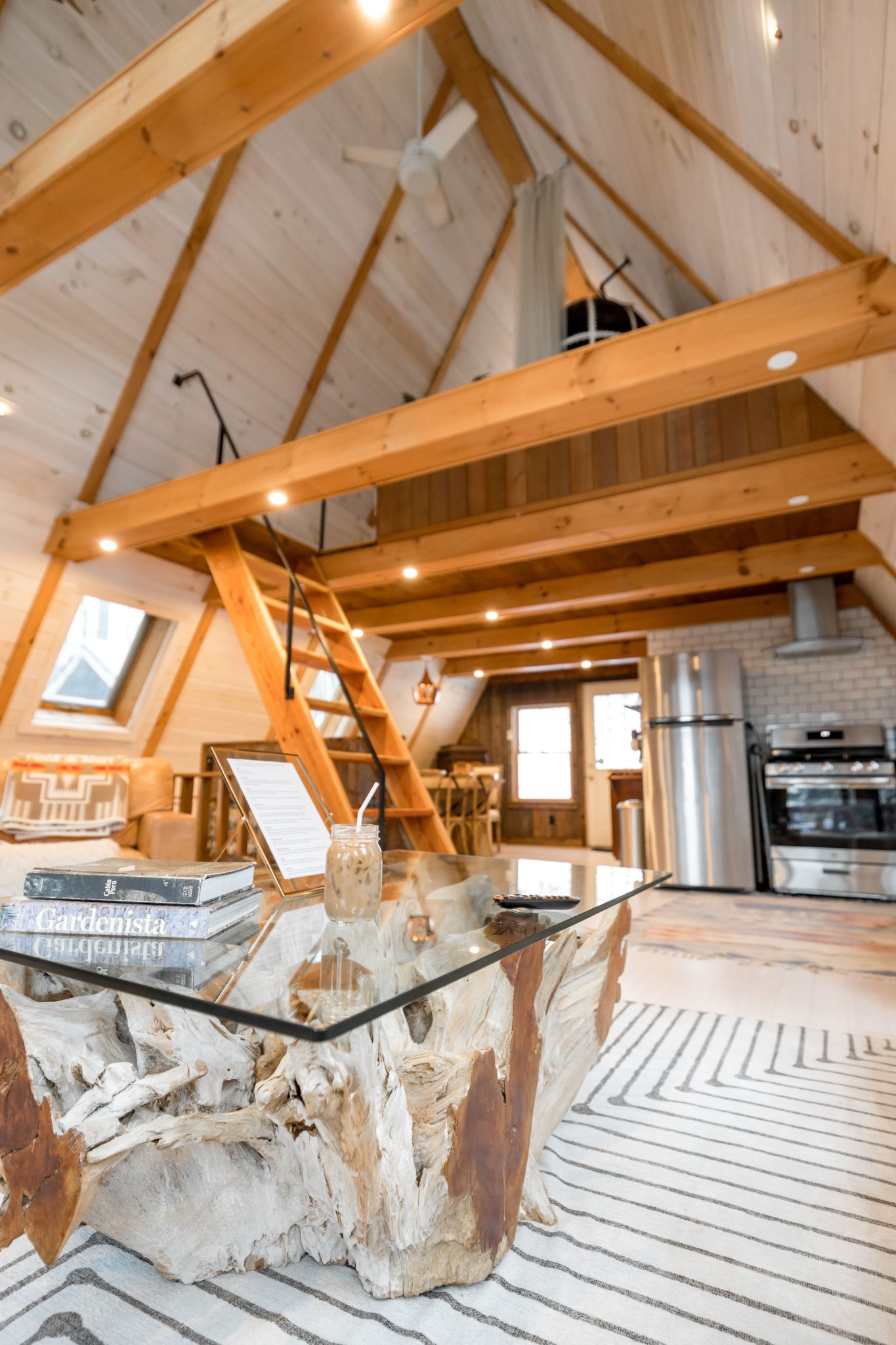 Bright and cozy A-frame cabin interior featuring modern design elements in Vermont, USA.