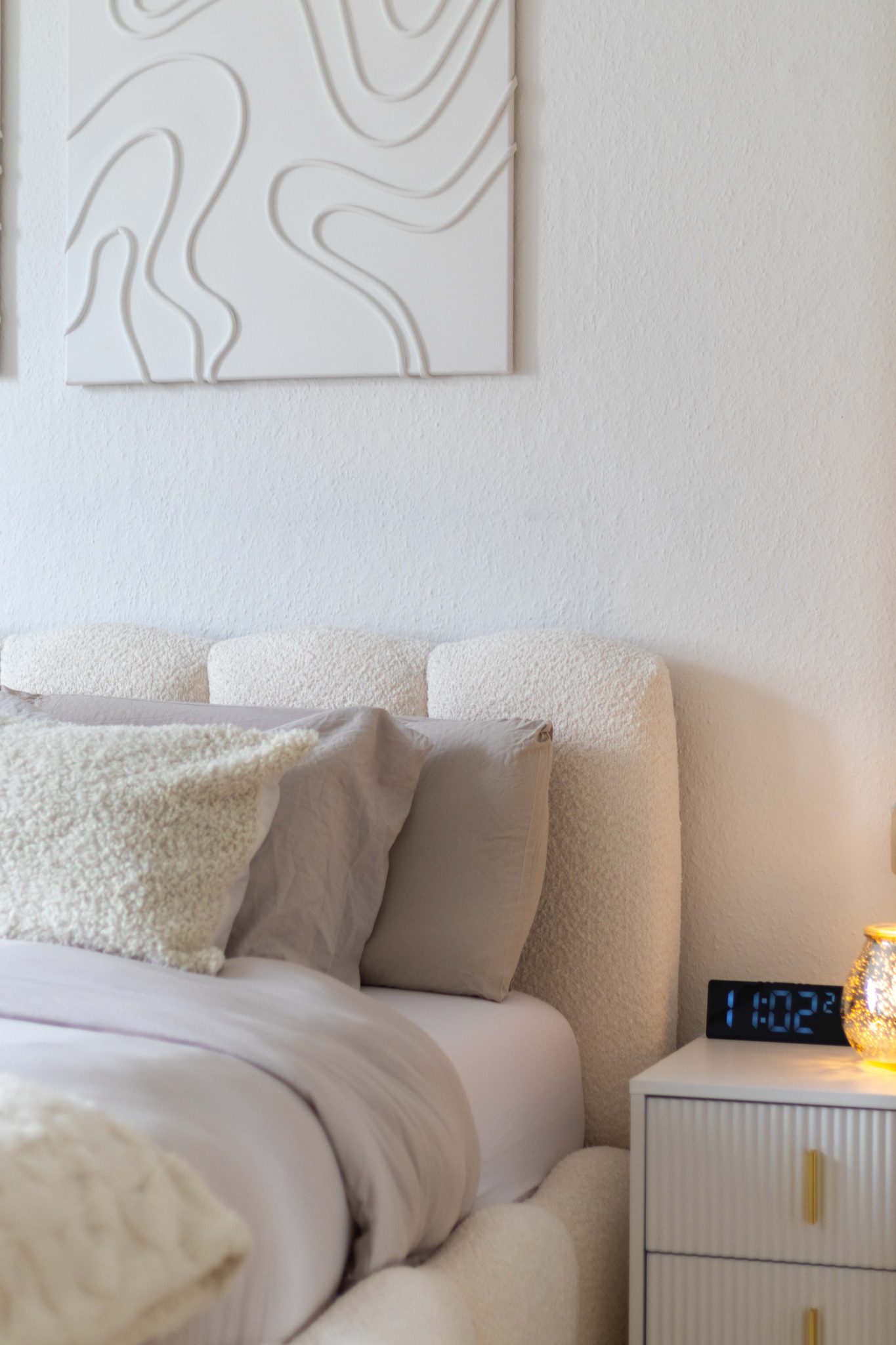 Cozy and bright modern bedroom with stylish decor for ultimate relaxation.