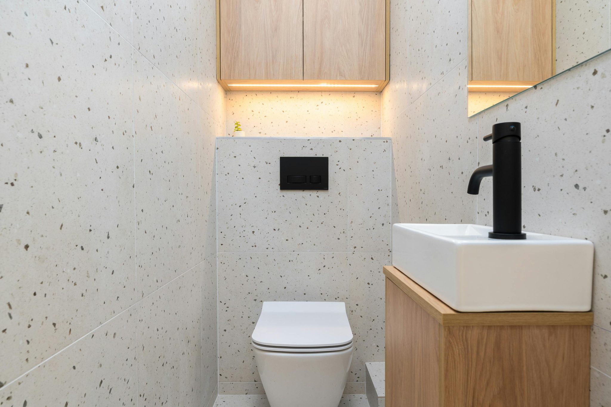Elegant minimalist bathroom with modern fixtures in Kraków, Poland.