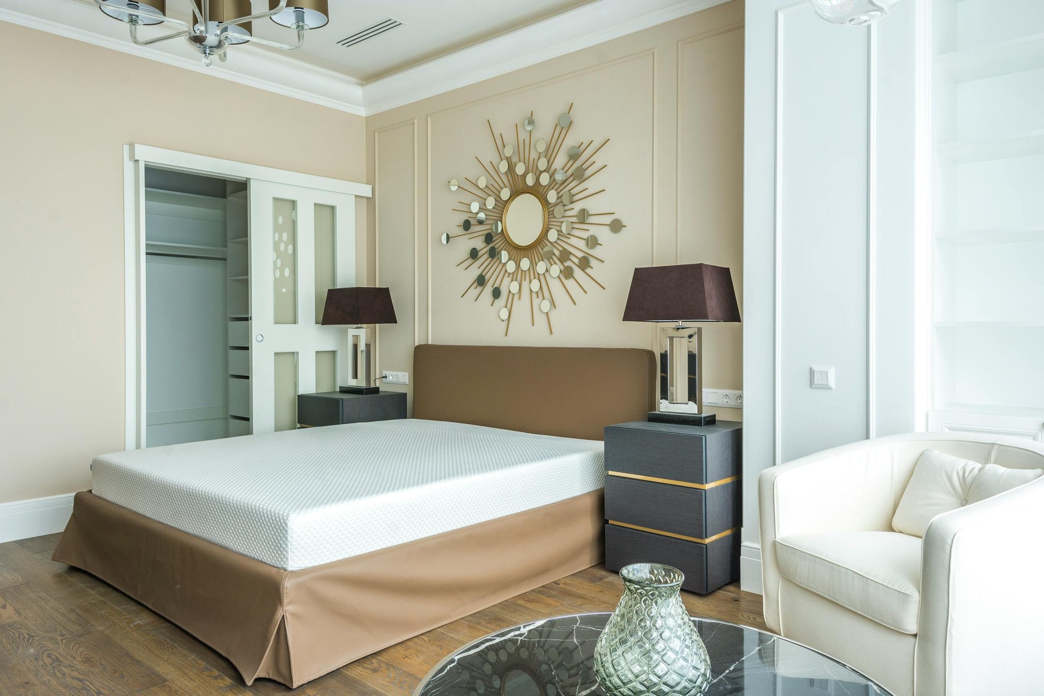 Elegant minimalist bedroom featuring contemporary decor and furniture.