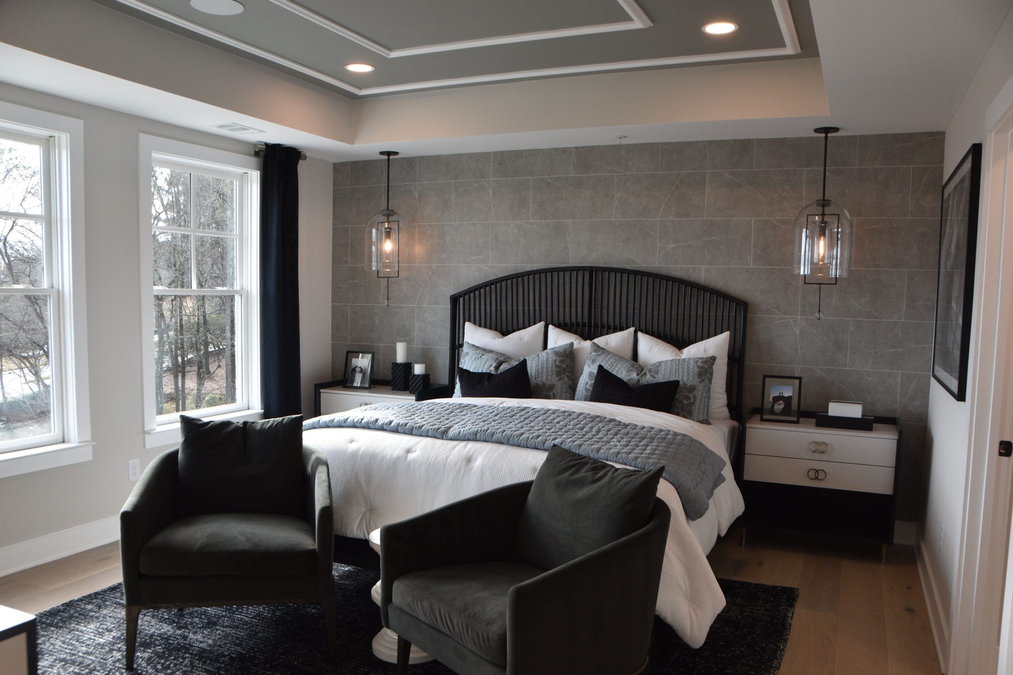 Elegant modern bedroom featuring stylish decor, cozy furniture, and soft lighting creating a warm ambiance.