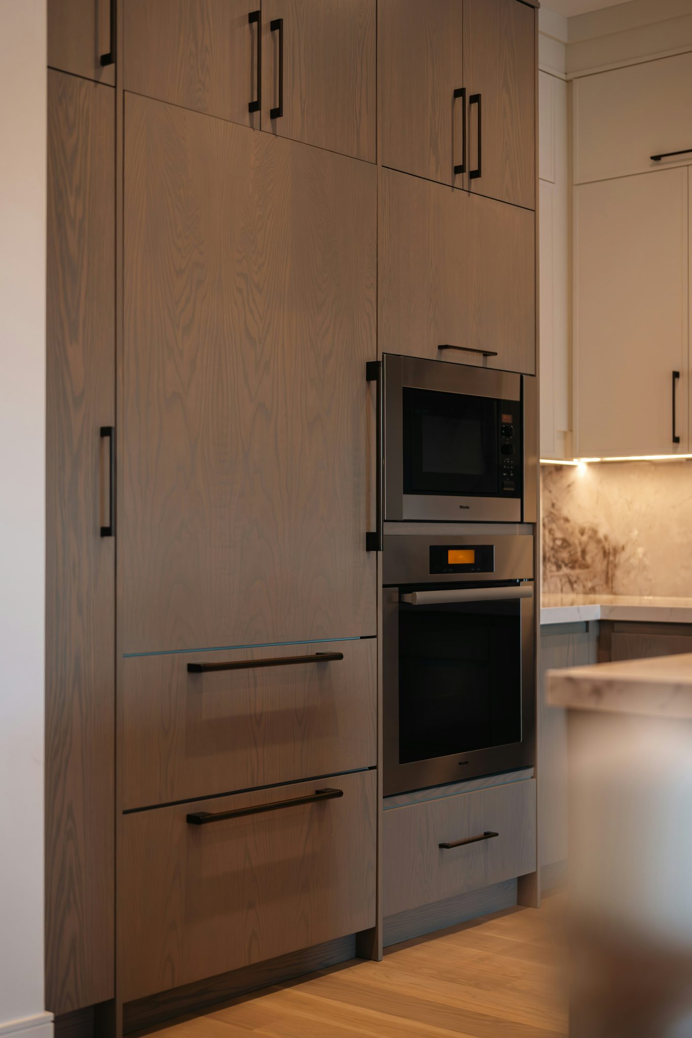 Modern kitchen with built-in oven and microwave