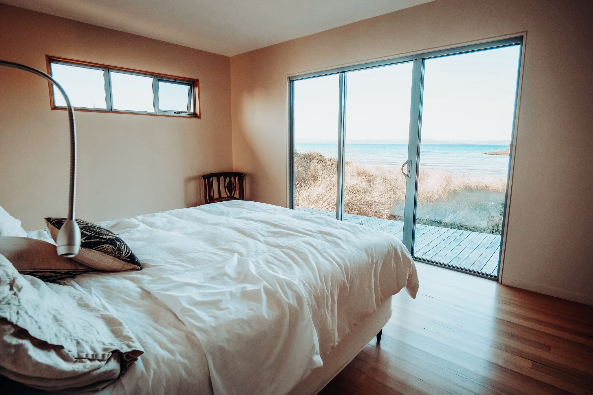 Relax in a serene bedroom overlooking the ocean, perfect for unwinding.