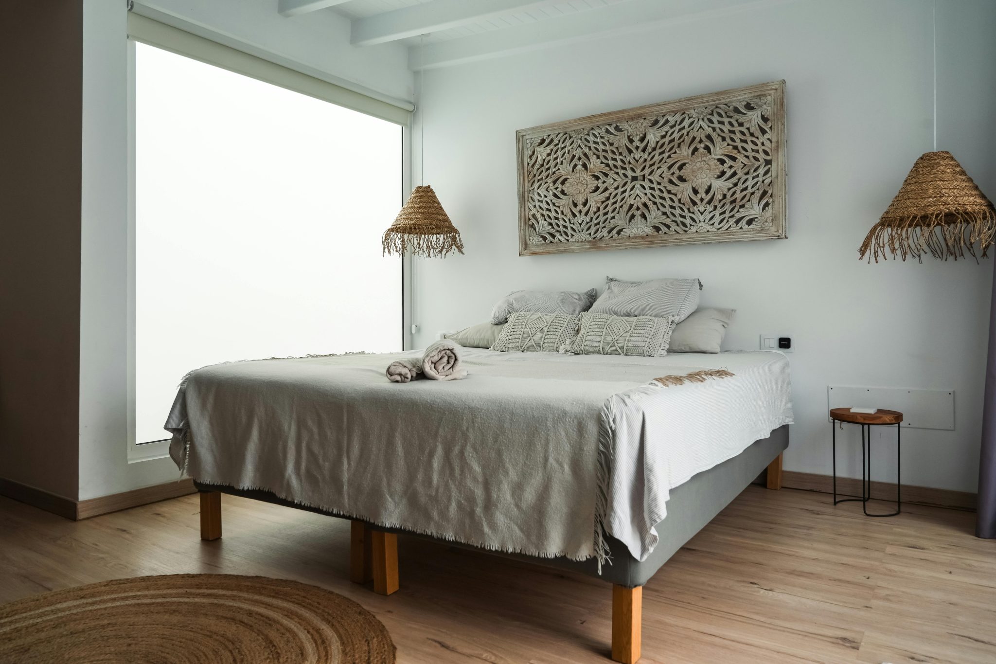 Stylish minimalist bedroom interior with natural decor in Lanzarote, Spain.