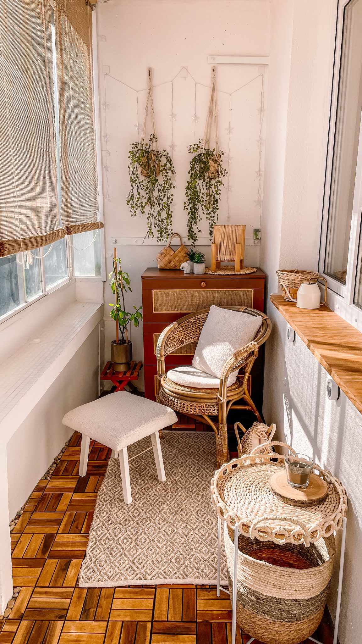 Warm and inviting boho-style balcony with rattan furniture and hanging plants.