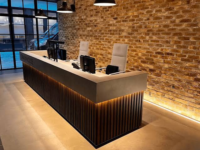 A Wooden Reception Desk of Modern Industrial Office Spaces - Custom Reception Desk
