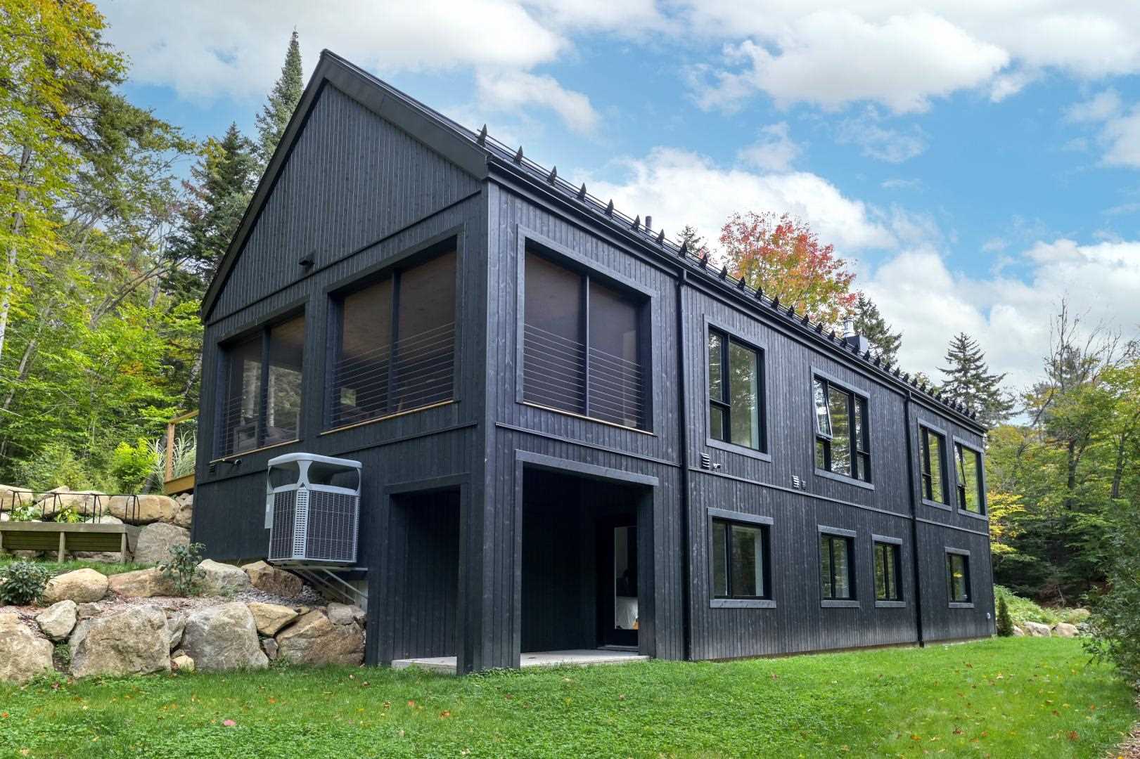 All Black Wood Siding Creates A Striking Exterior For This New House - Architecture Collection