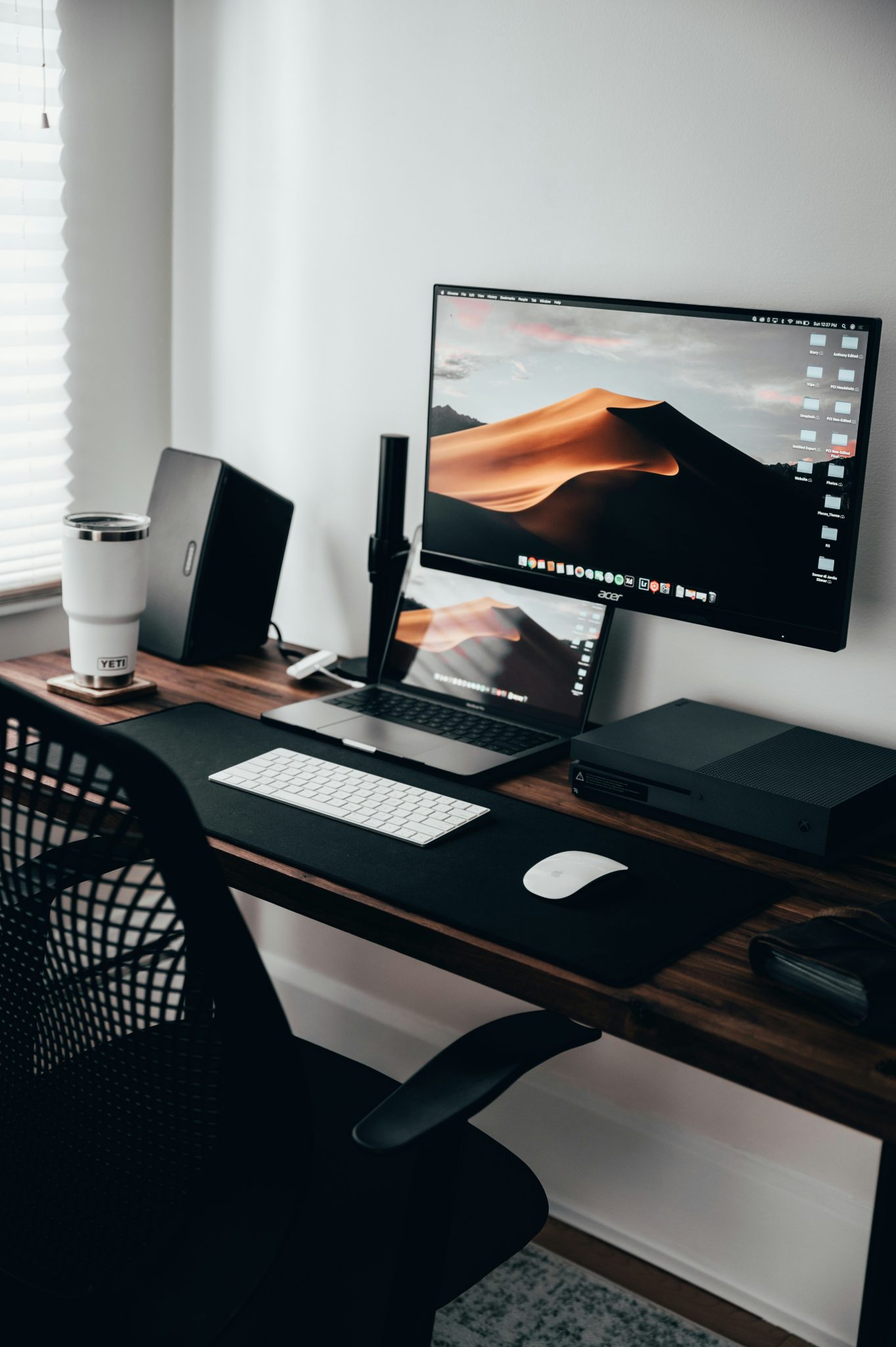 Here's a little closer up shot of my desk that was created with solid black walnut wood. Monitor is an Acer and the arm I bought from Amazon. Overall, a super clean and simple desk setup where creativ