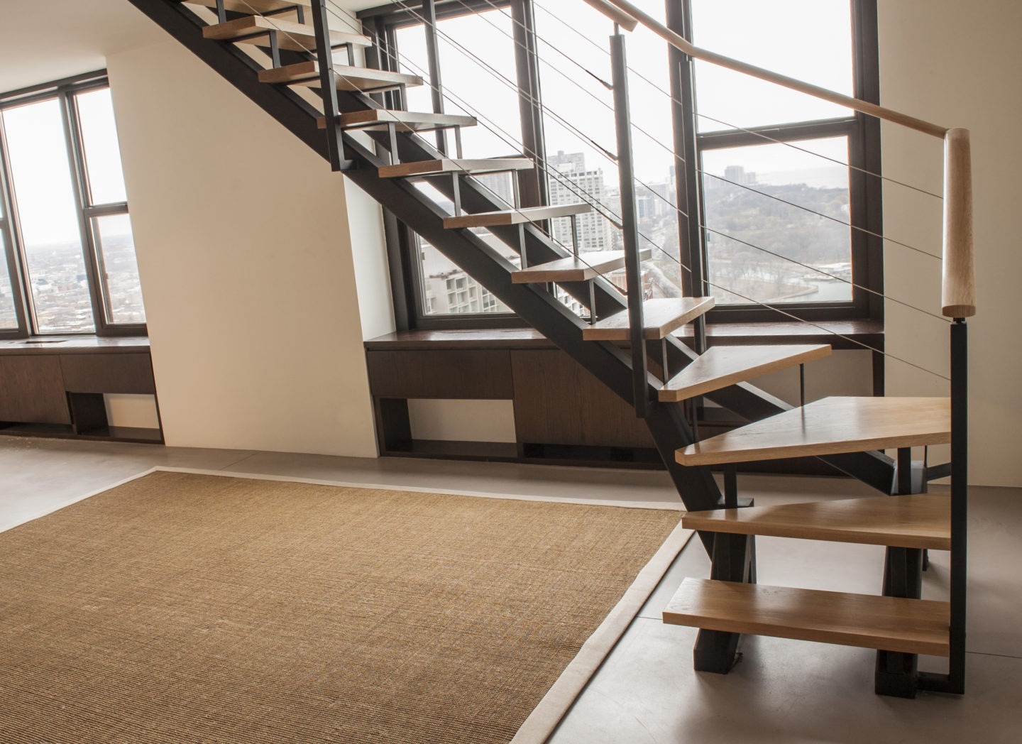 Looking for custom Minimalist open riser winder stairs? | Signature Metal Works