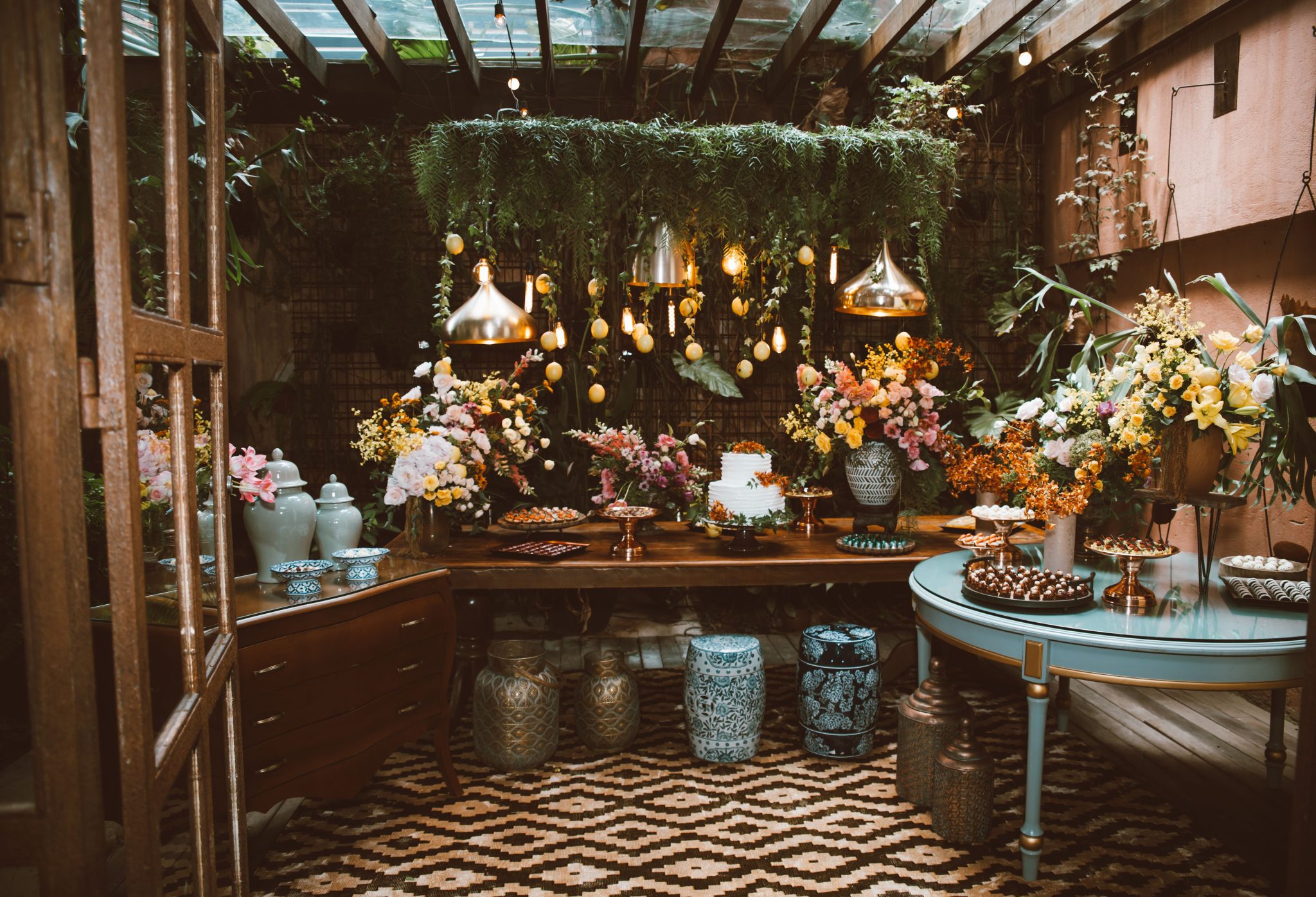 Luxurious indoor garden setting with elegant floral arrangements and ambient lighting.