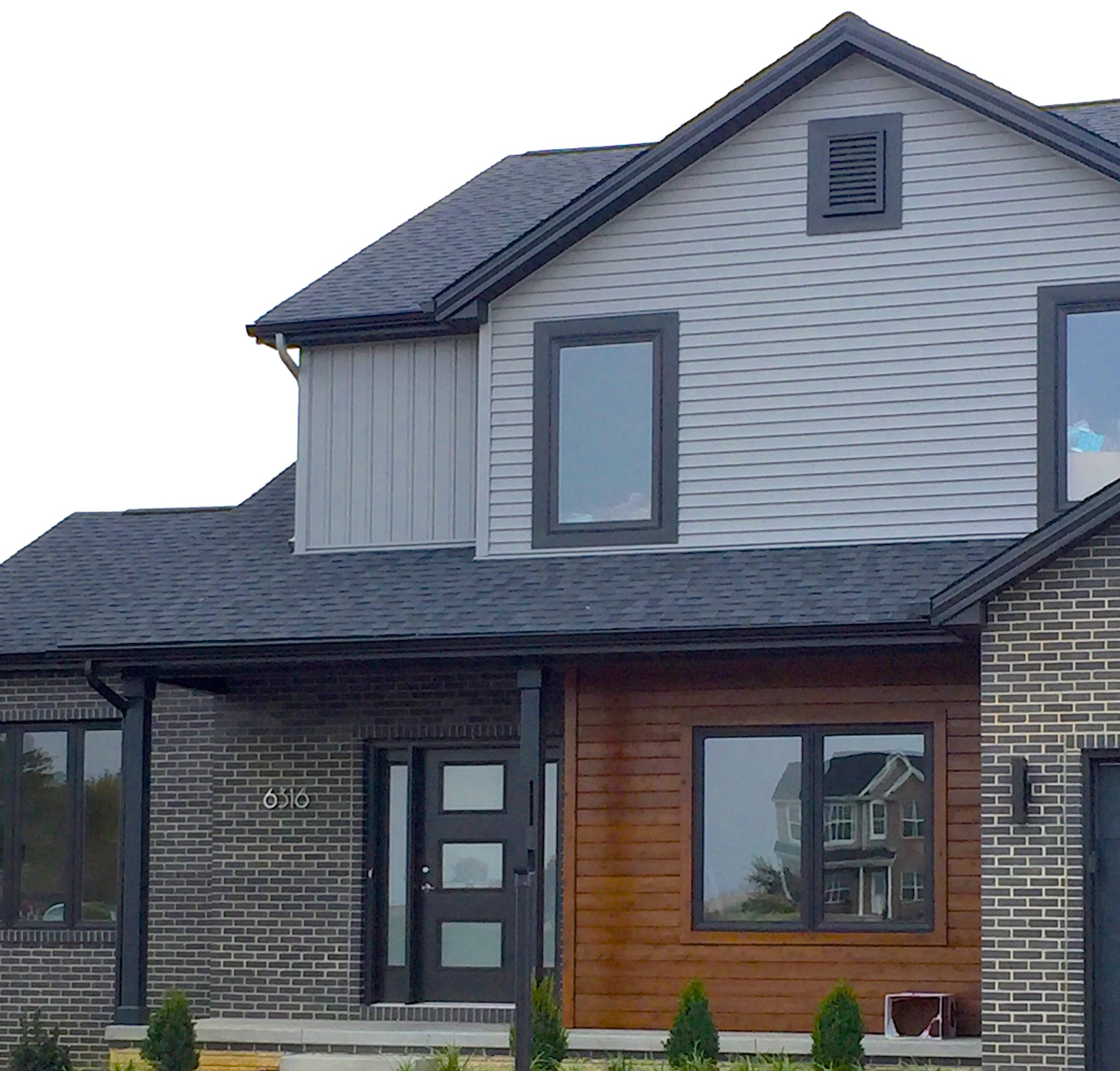 mastic-deep-granite-grey-siding-black-trim-cedar -siding-accent-certinteed-landmark-moire-black-shingles-peoria-il – Carlson Exteriors Inc.
